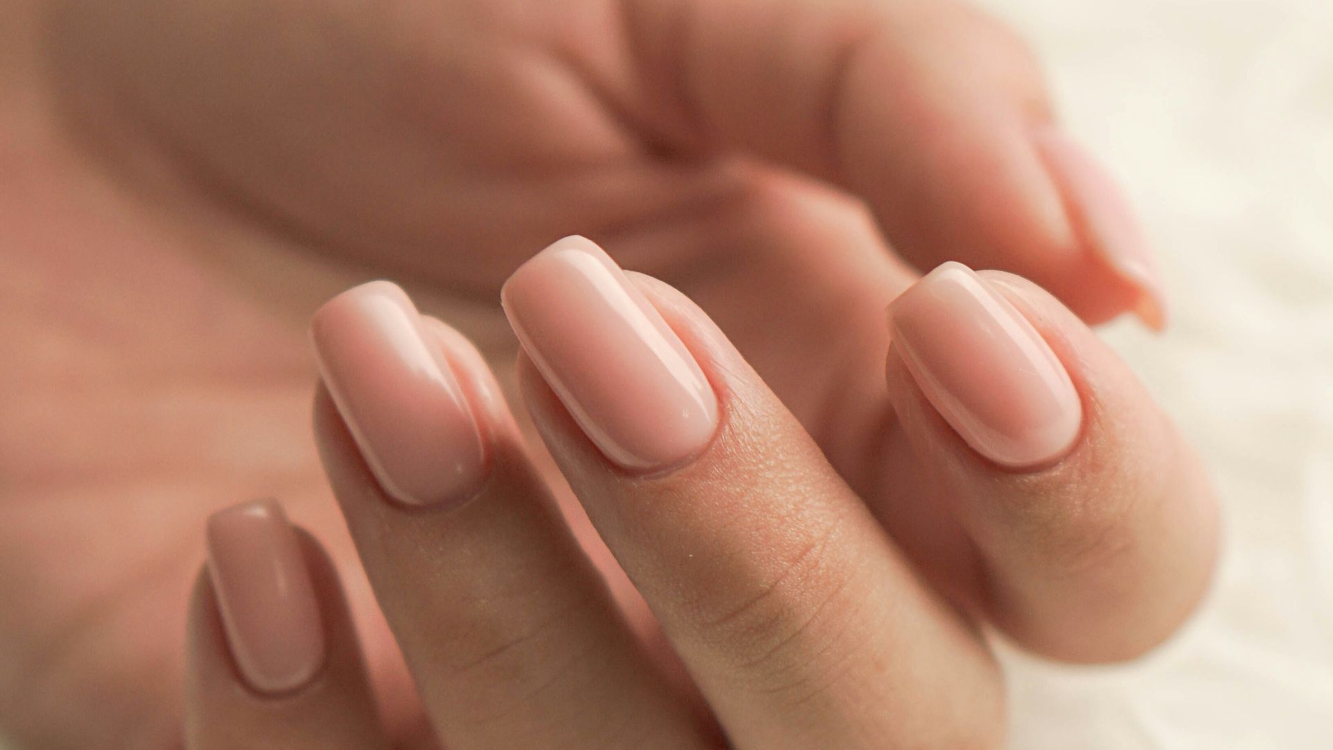 persons feet on white textile