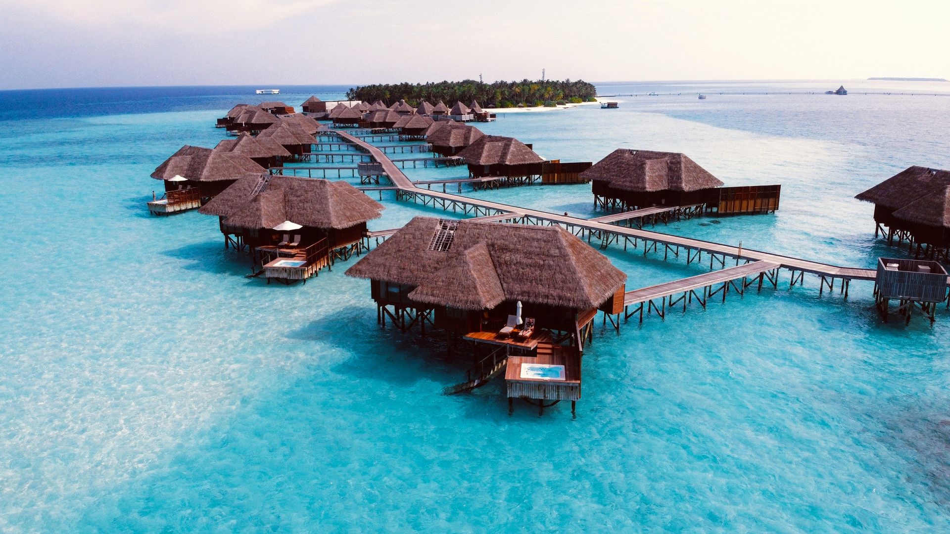 brown wooden cottage on blue body of water during daytime