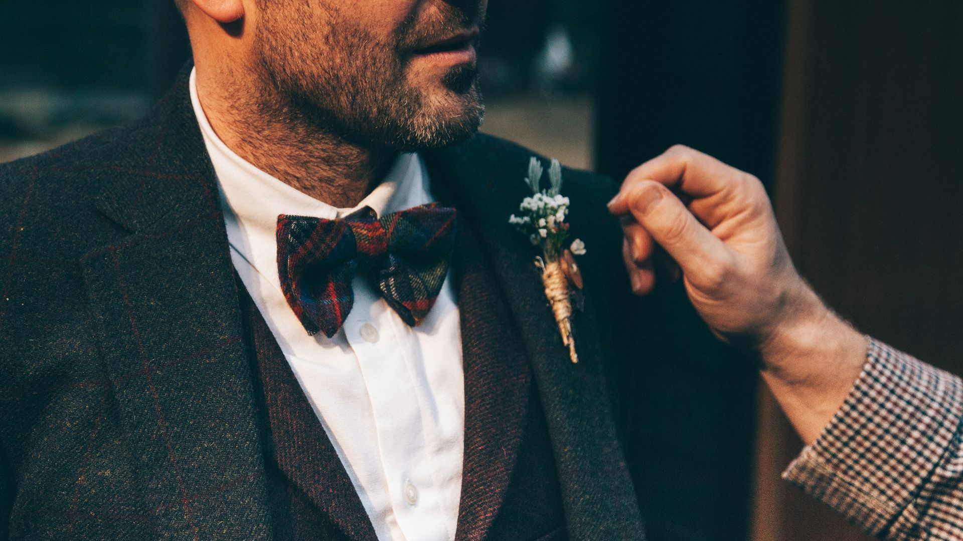 man wearing black suit jacket