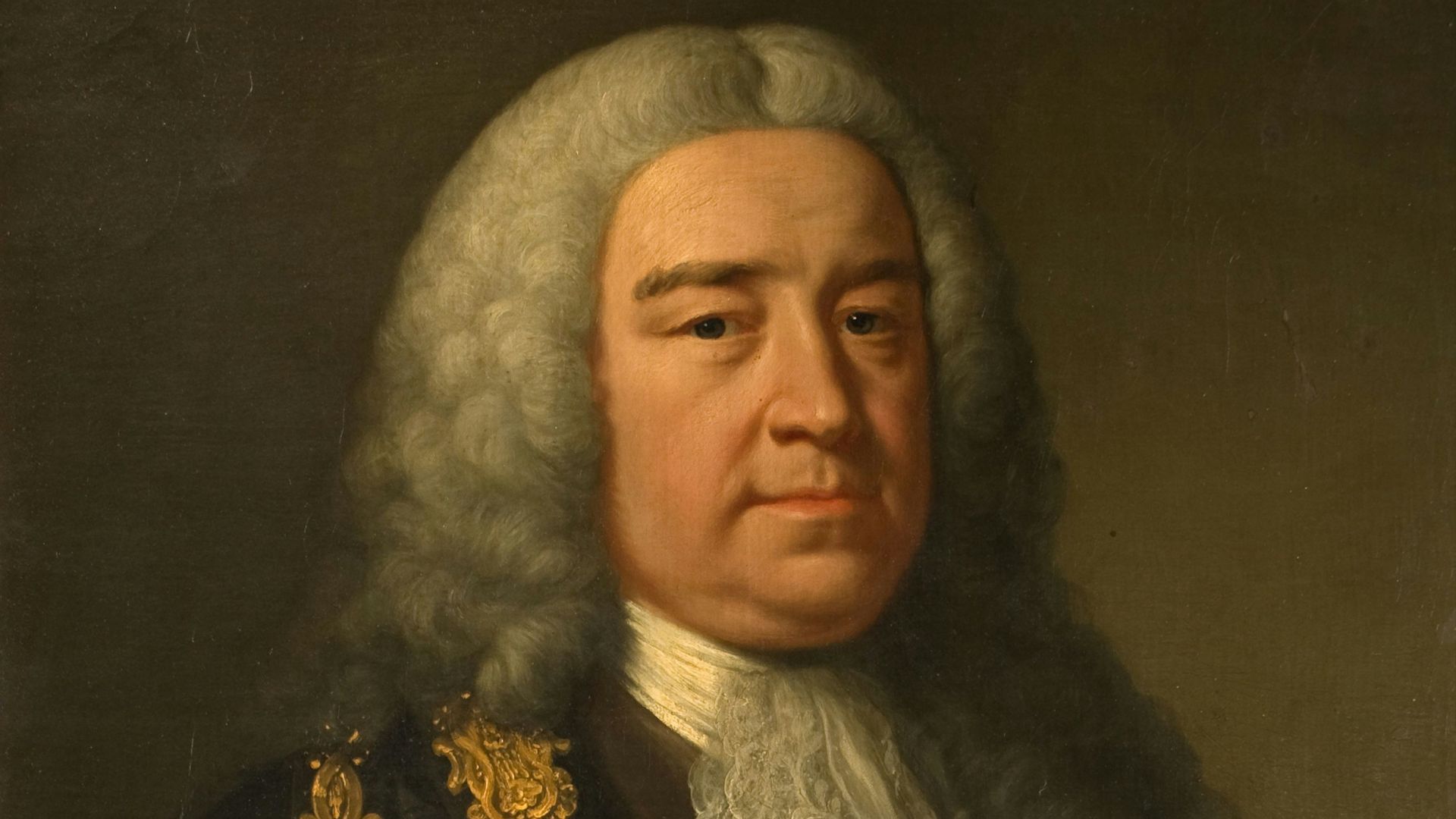 woman in black and gold floral dress