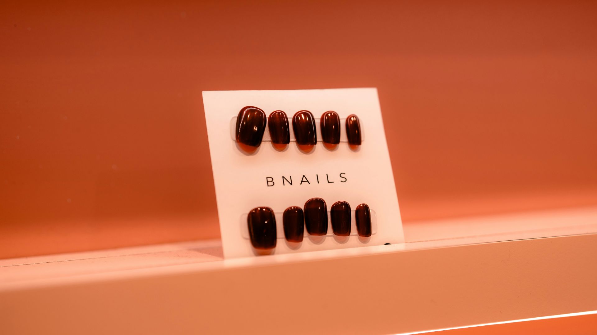 A display of nails on a shelf in a bathroom