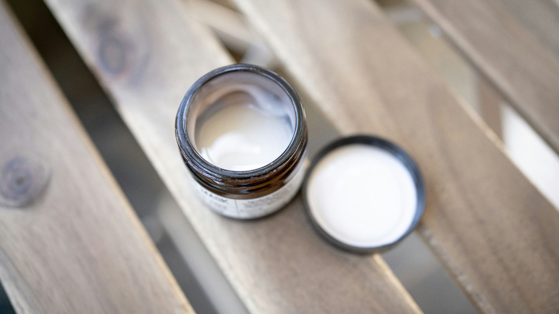 silver ring on brown wooden table