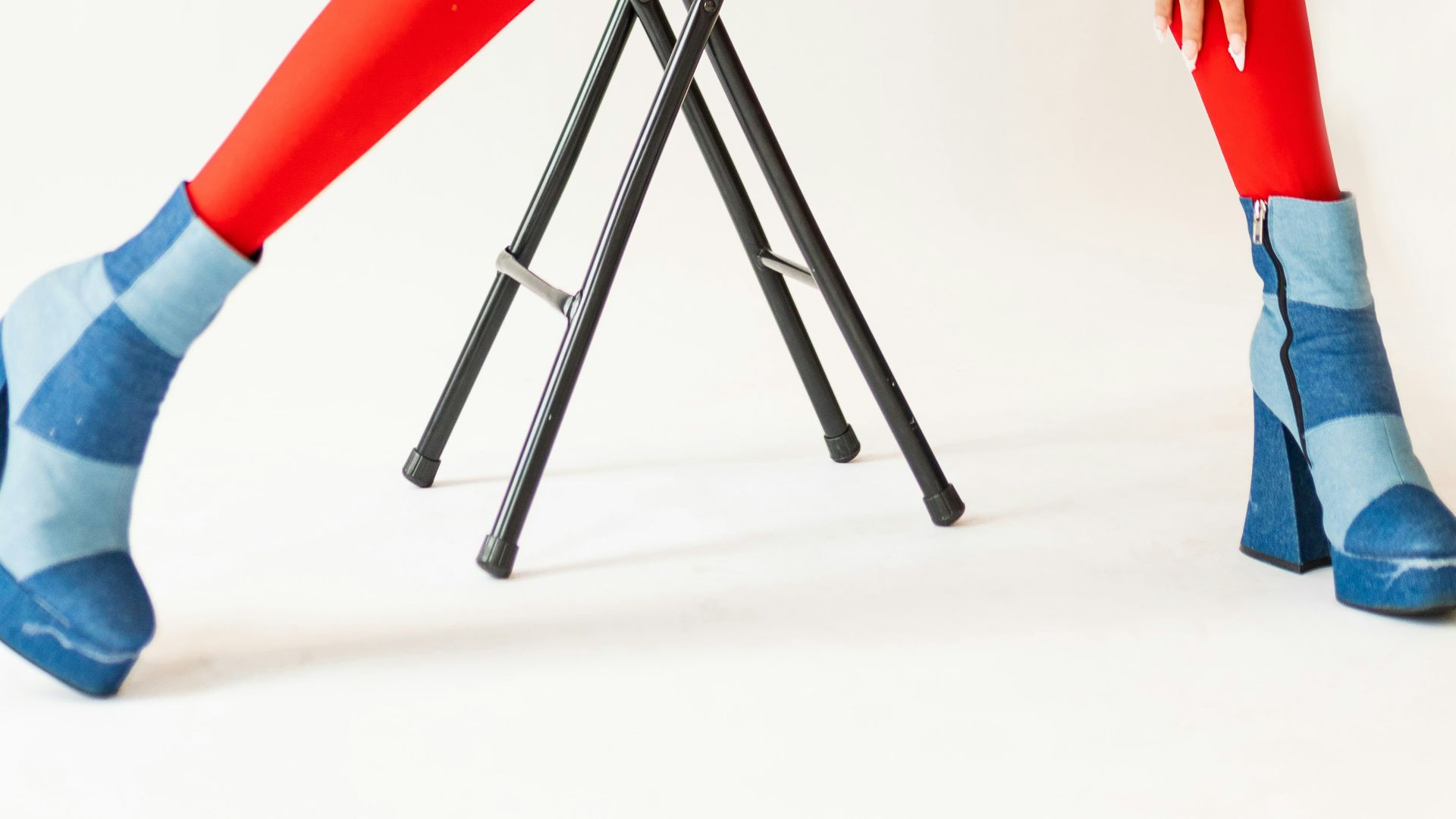 a woman sitting on a chair with her legs crossed