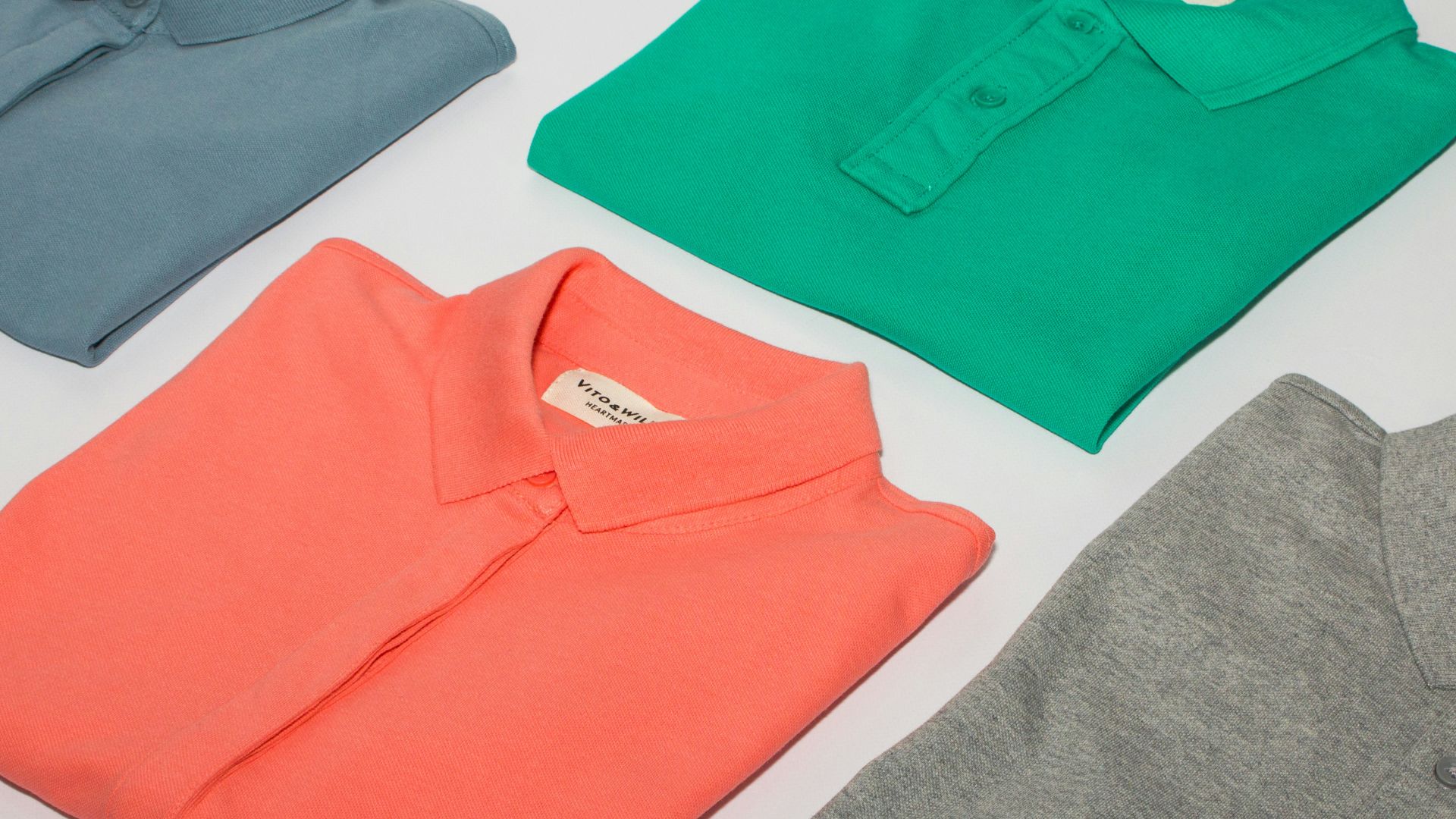 green crew neck shirt and gray crew neck shirt