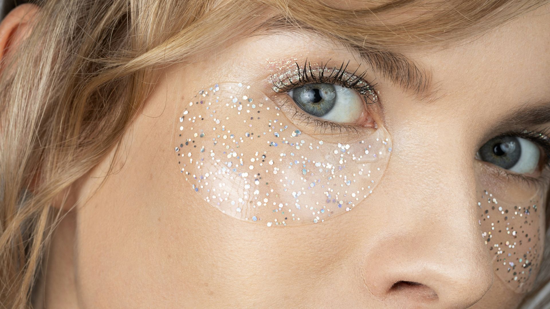a woman with glitter on her face