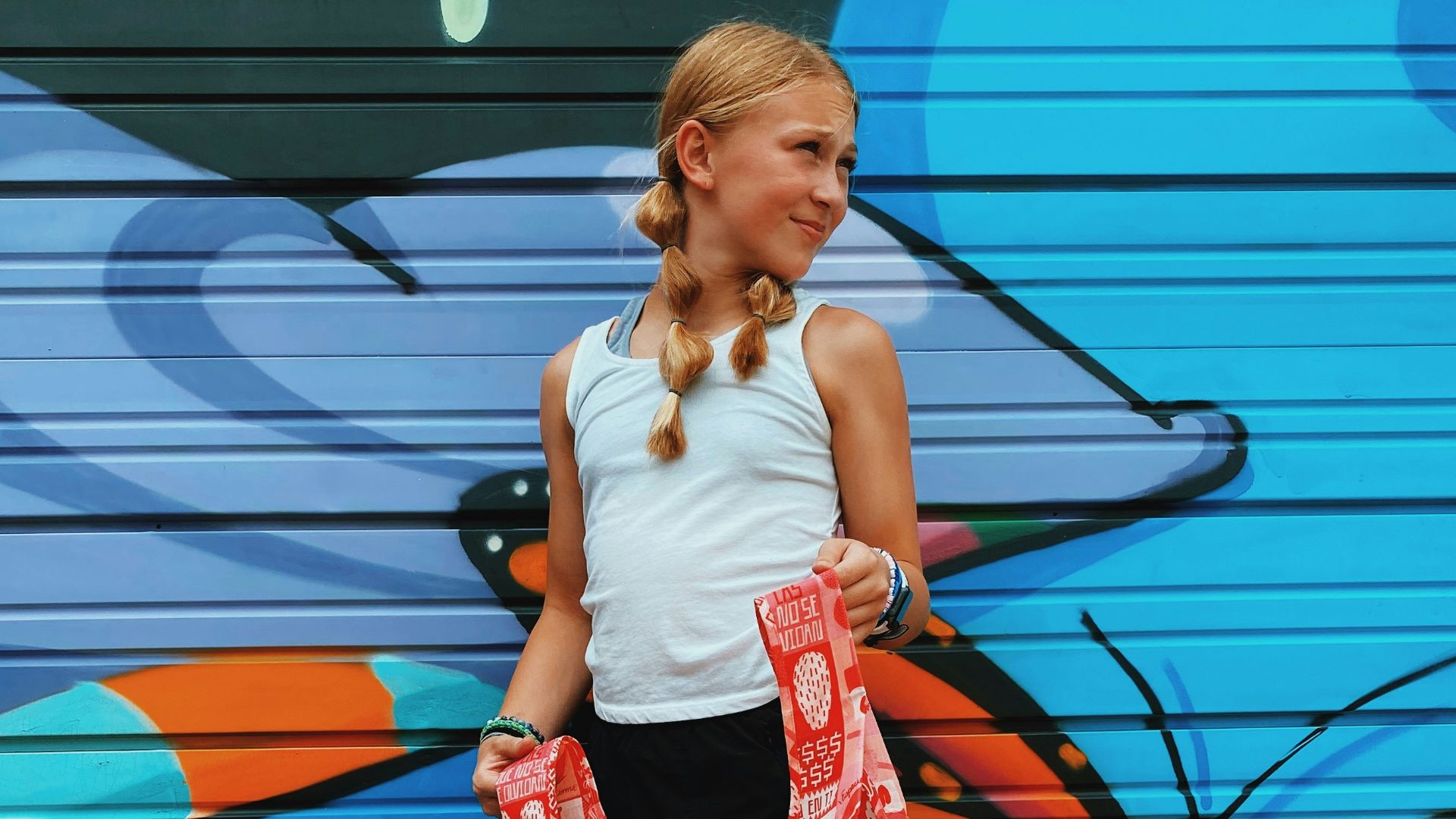 a woman holding a red umbrella