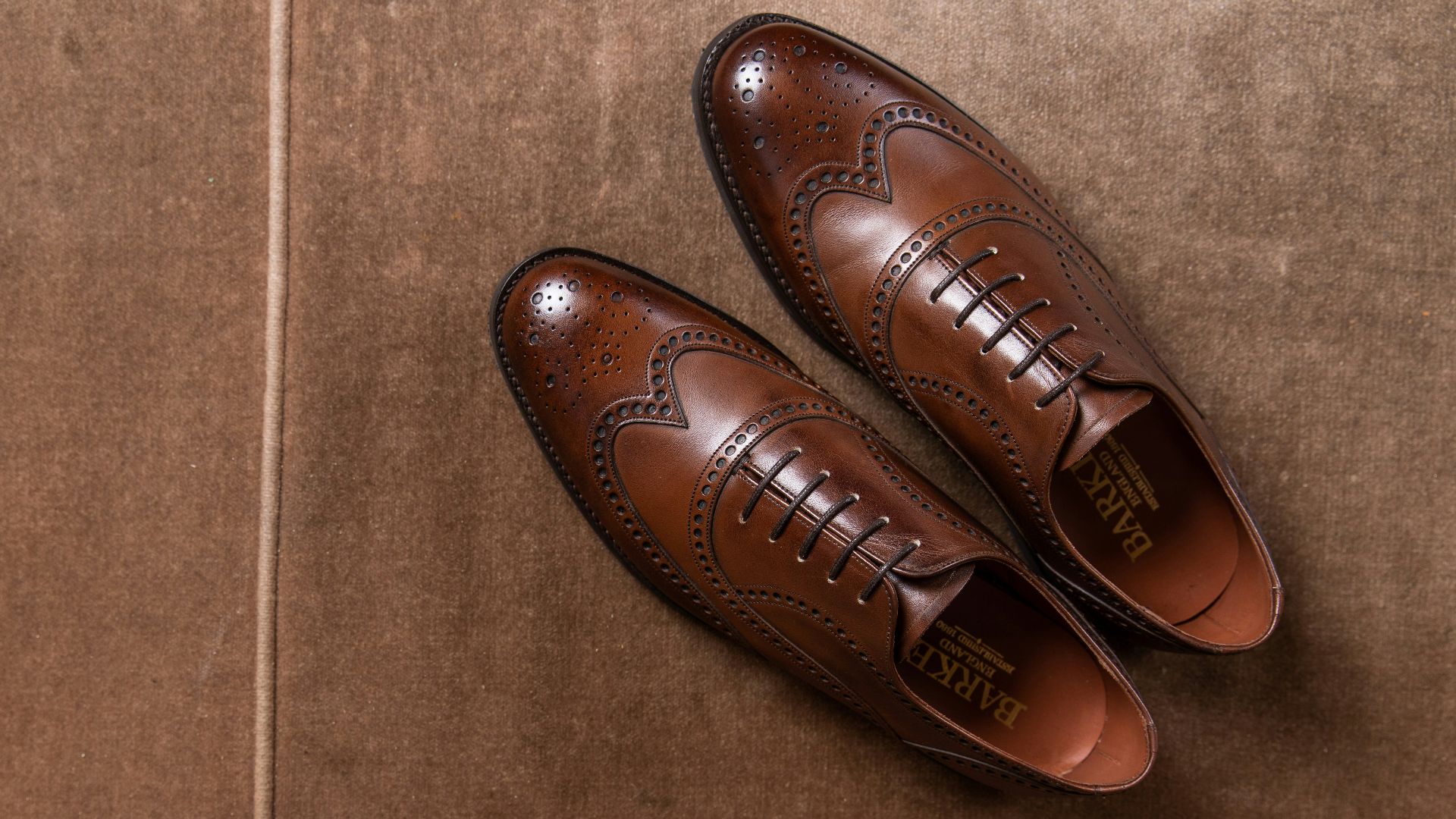 brown leather shoes on brown floor tiles