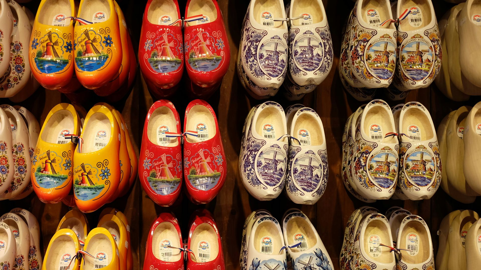 A bunch of shoes that are on a shelf