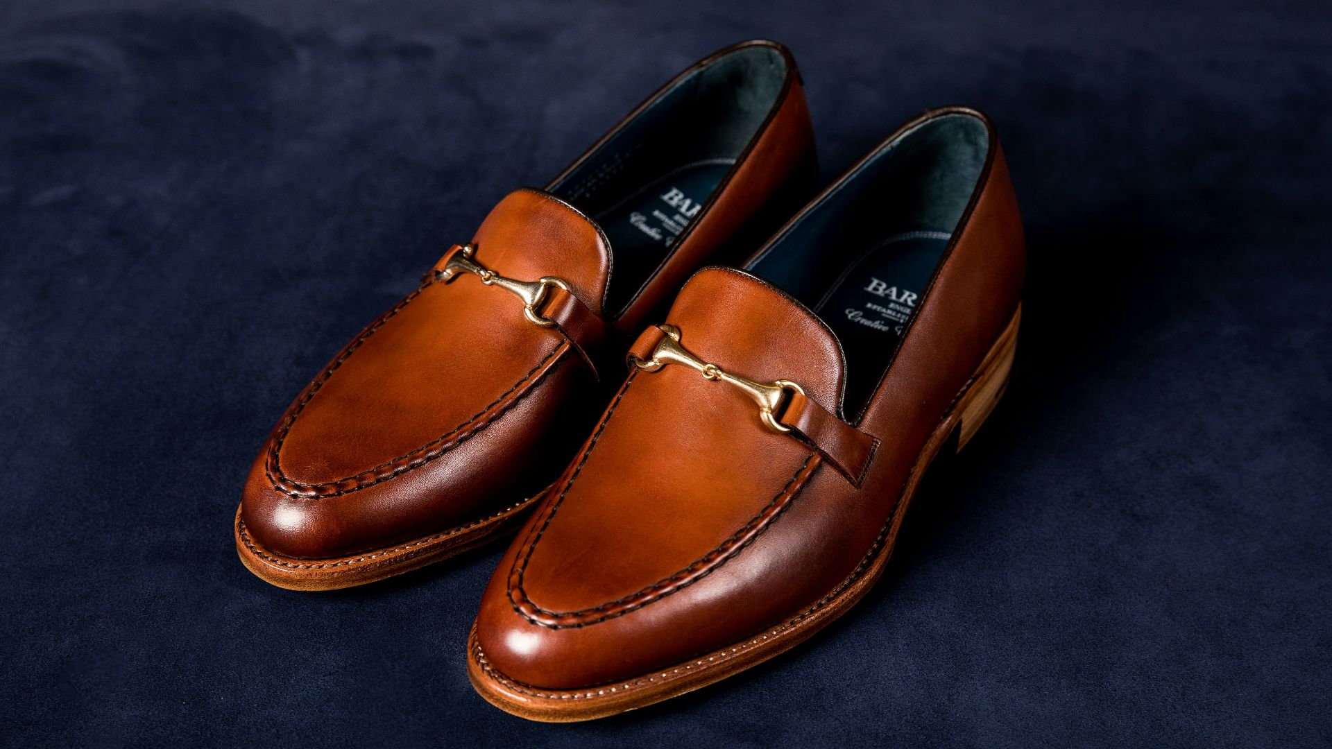 brown leather loafers on blue textile