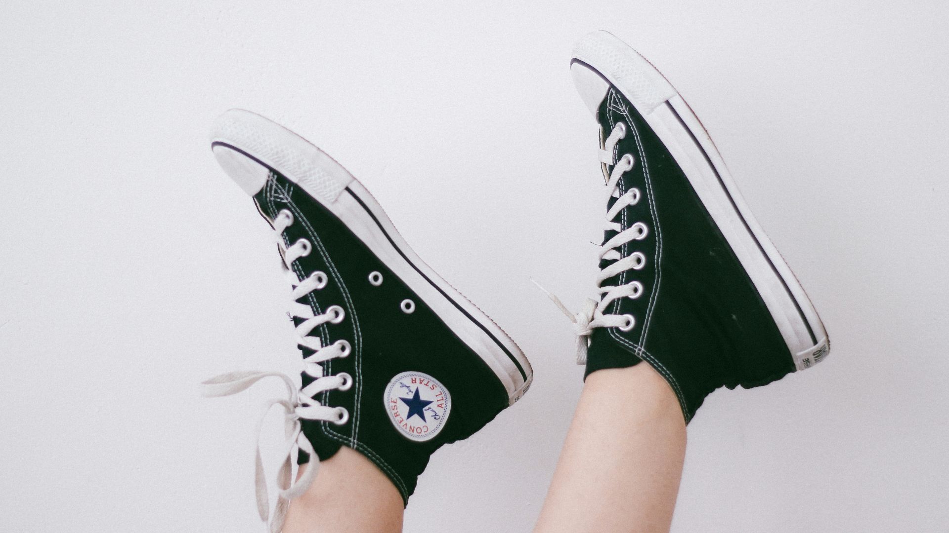 black and black and white Converse All Star high-top sneakers