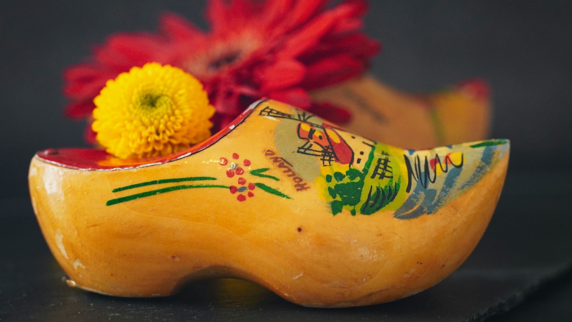 Wooden shoes decorated with flowers.
