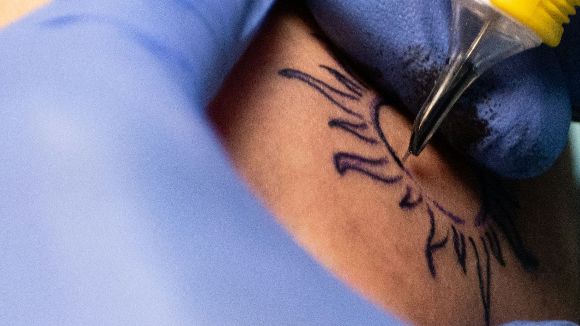 A person is getting tattooed.