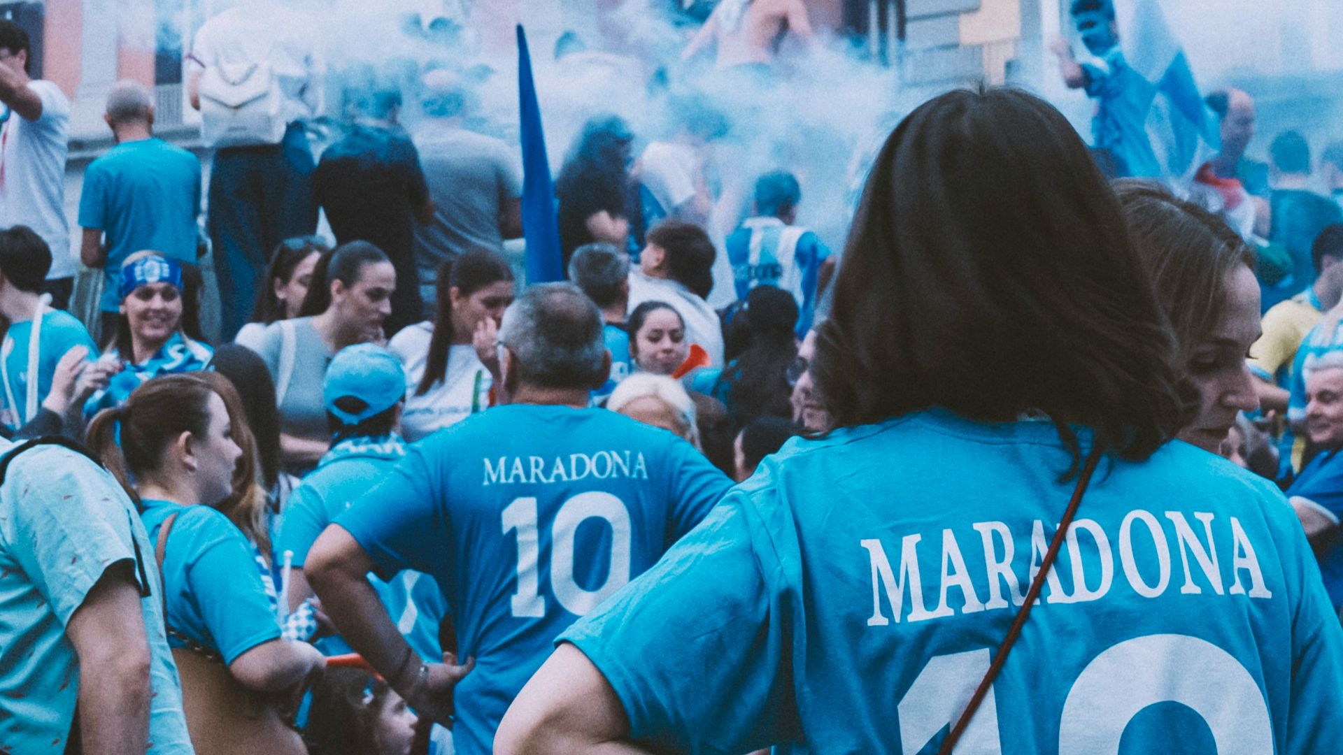 a group of people standing around each other