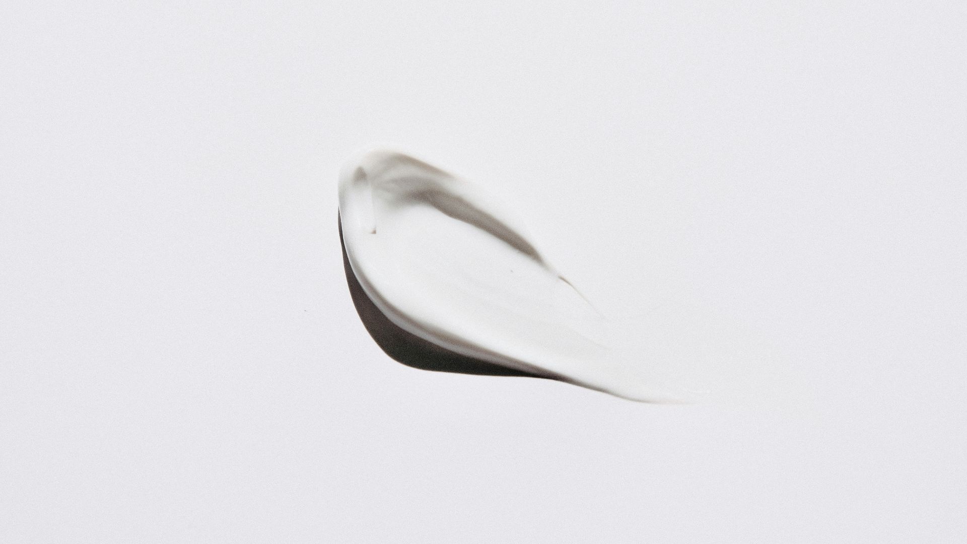 stainless steel spoon on white surface