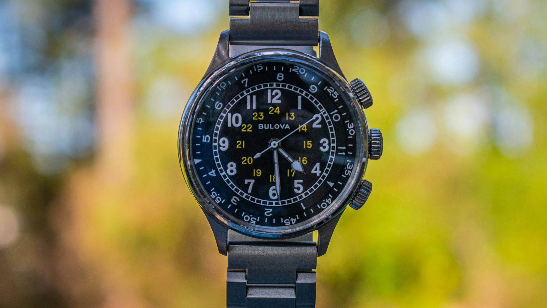 A black watch sitting on top of a table