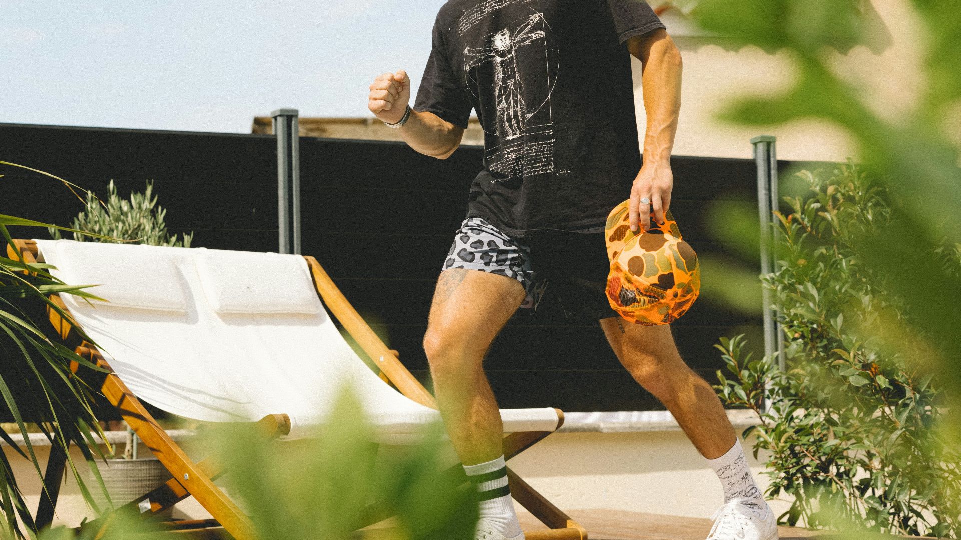 woman in black and yellow dress sitting on white chair