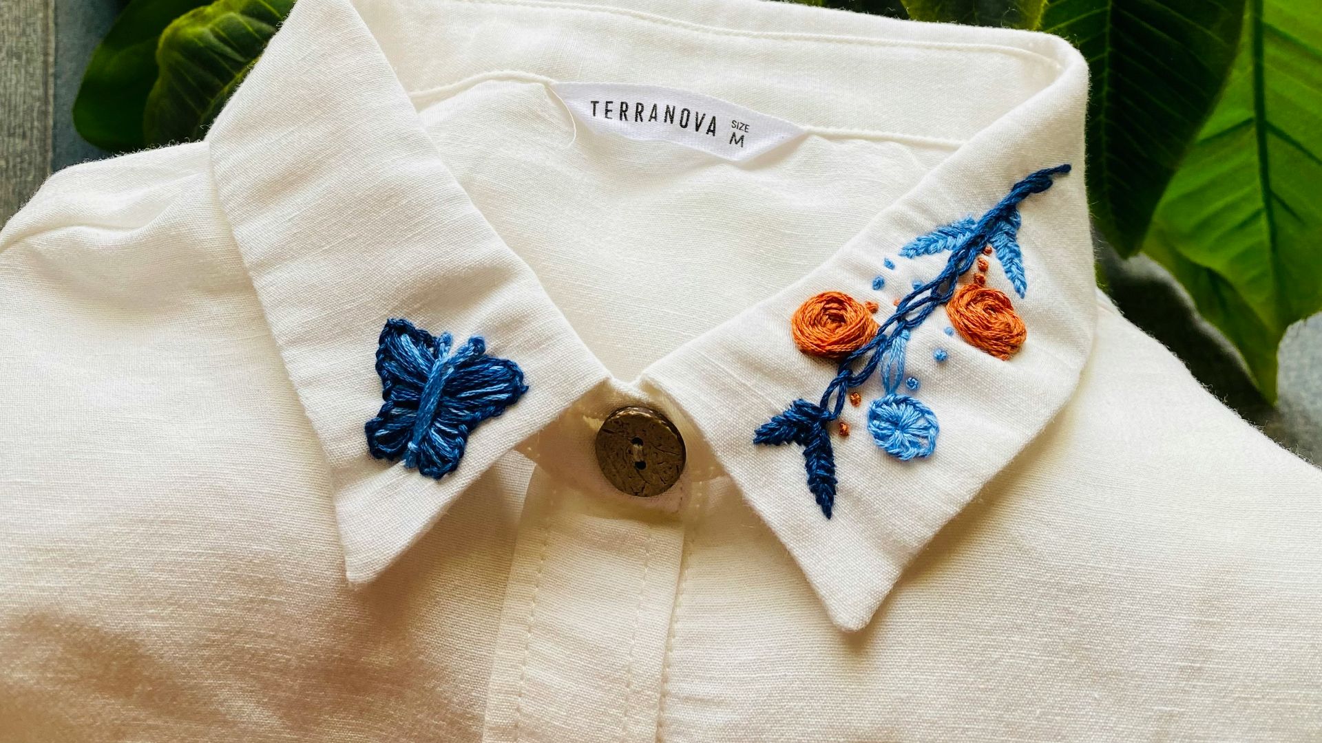 green leaves on white textile