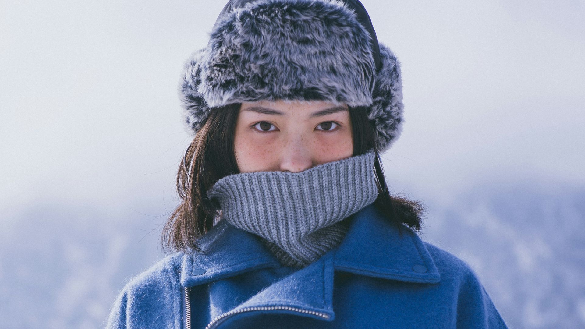 woman in blue jacket
