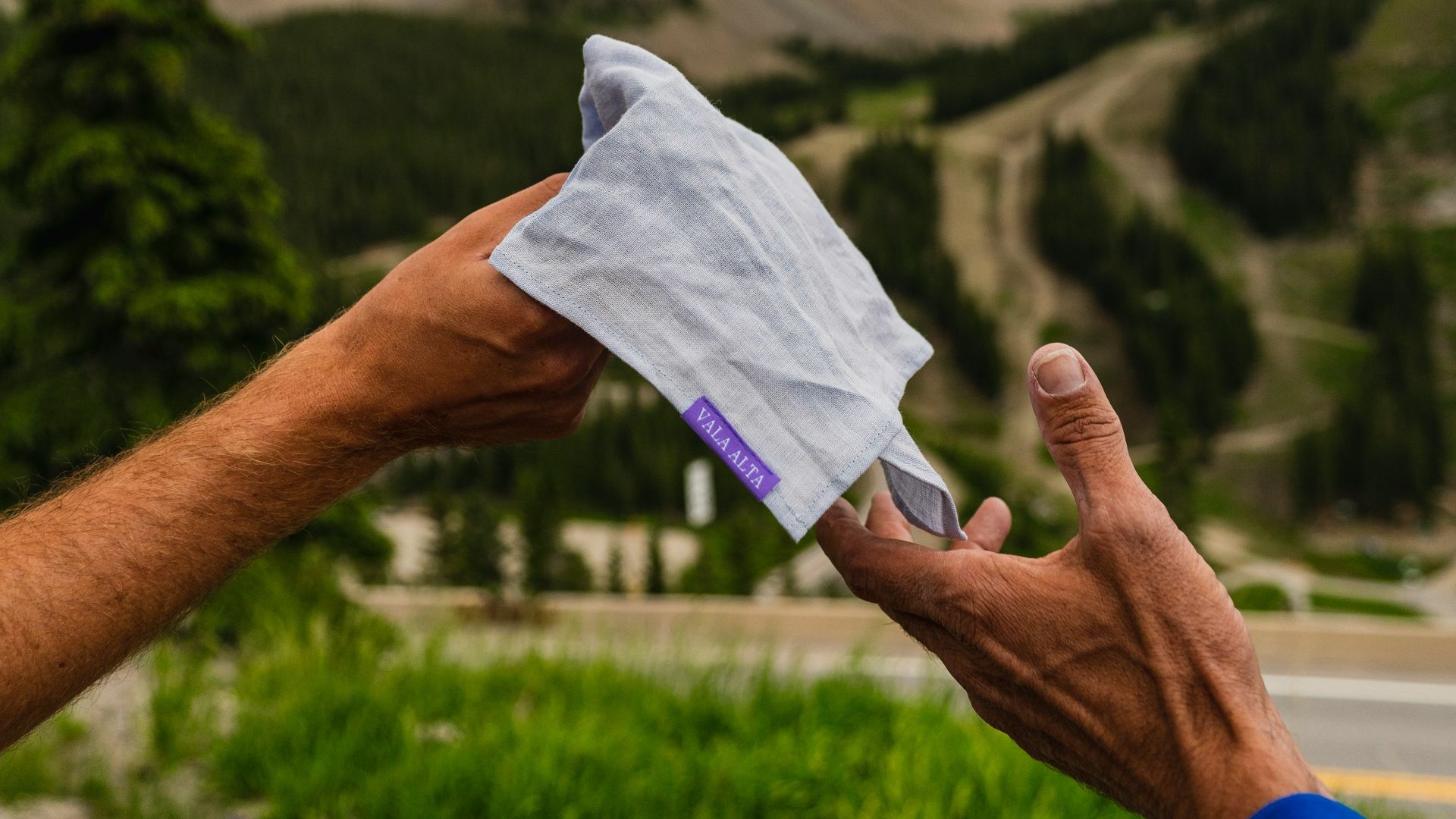 a person holding a piece of paper in their hand