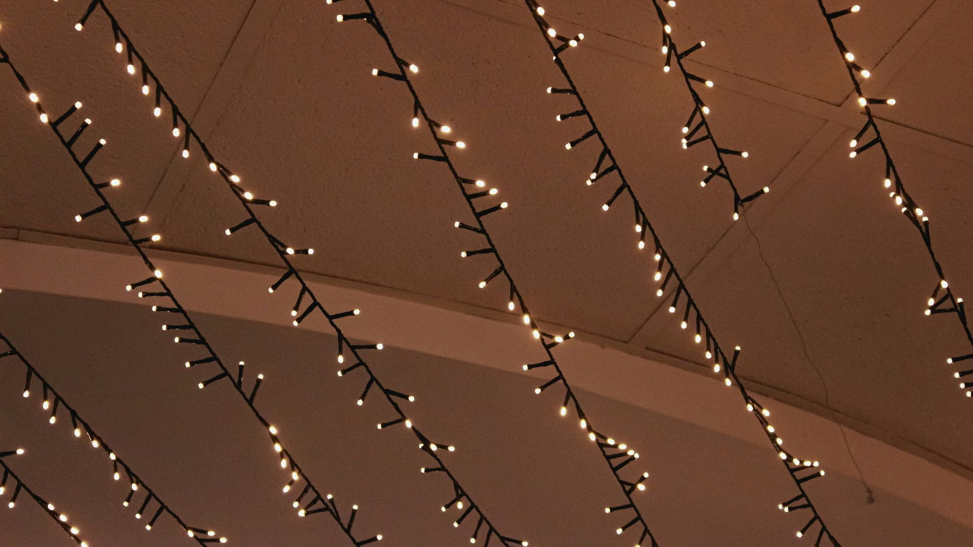 A ceiling with lights hanging from it's sides