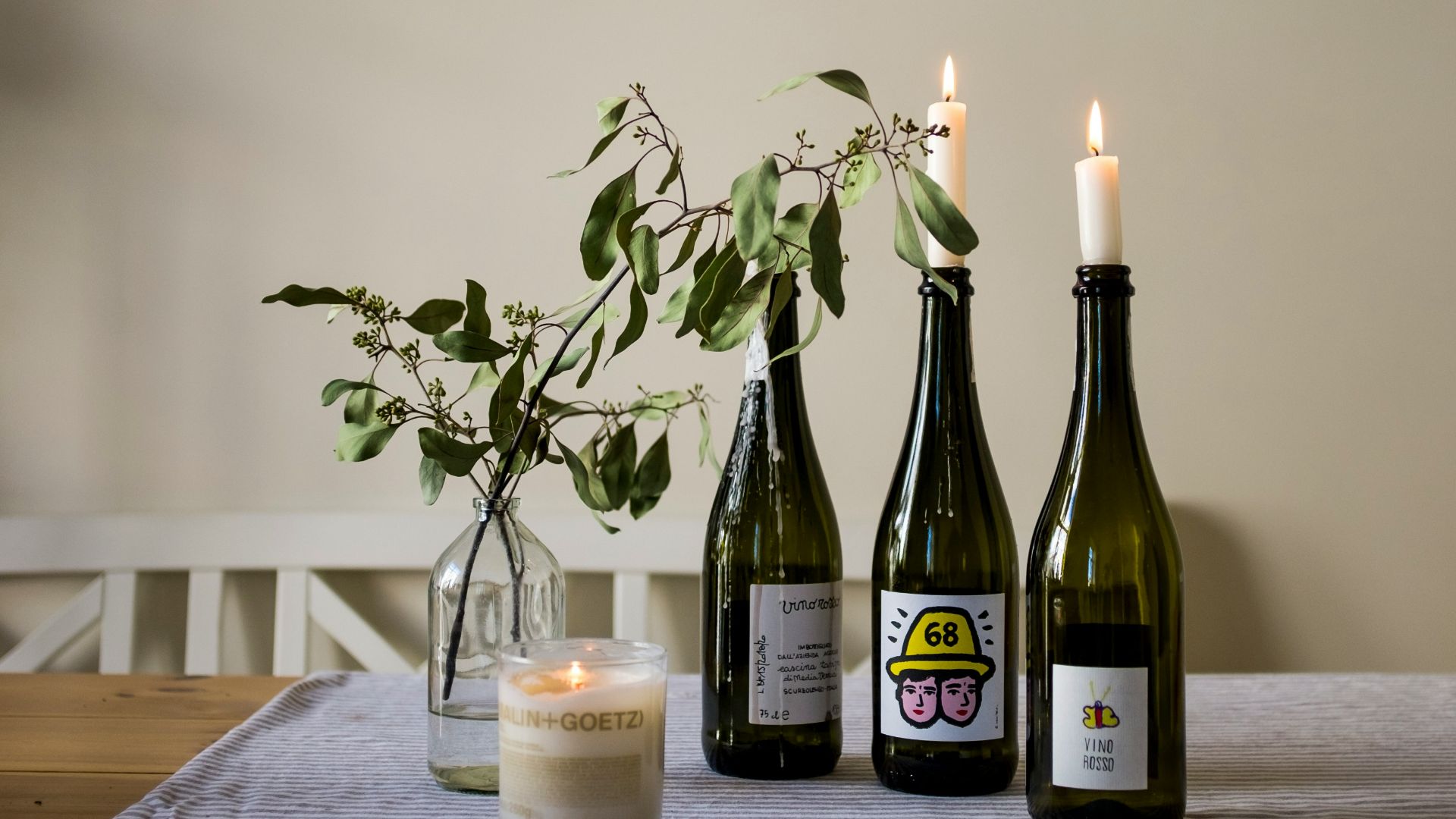 green wine bottle on brown wooden table