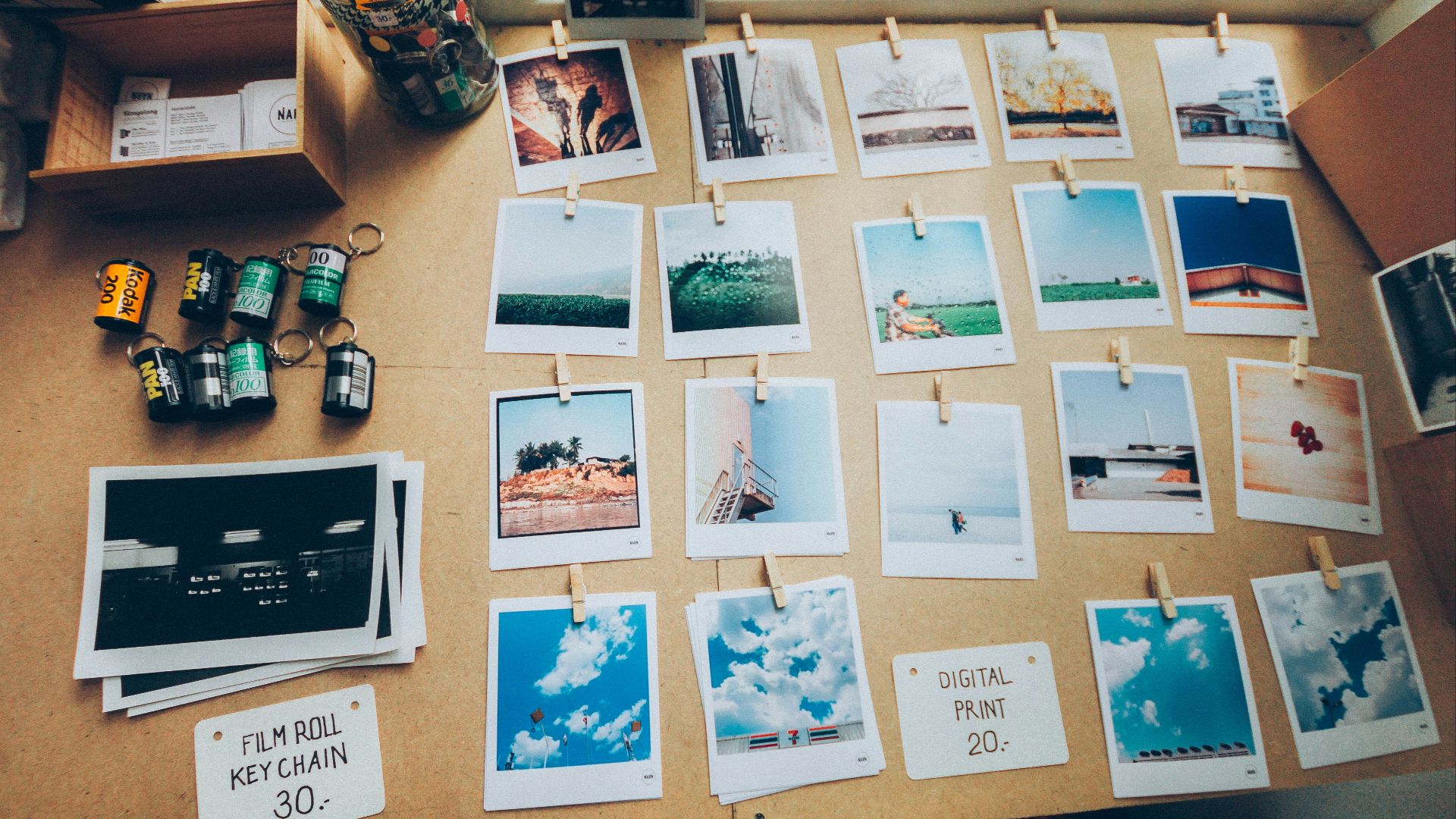 assorted photos on beige wooden table