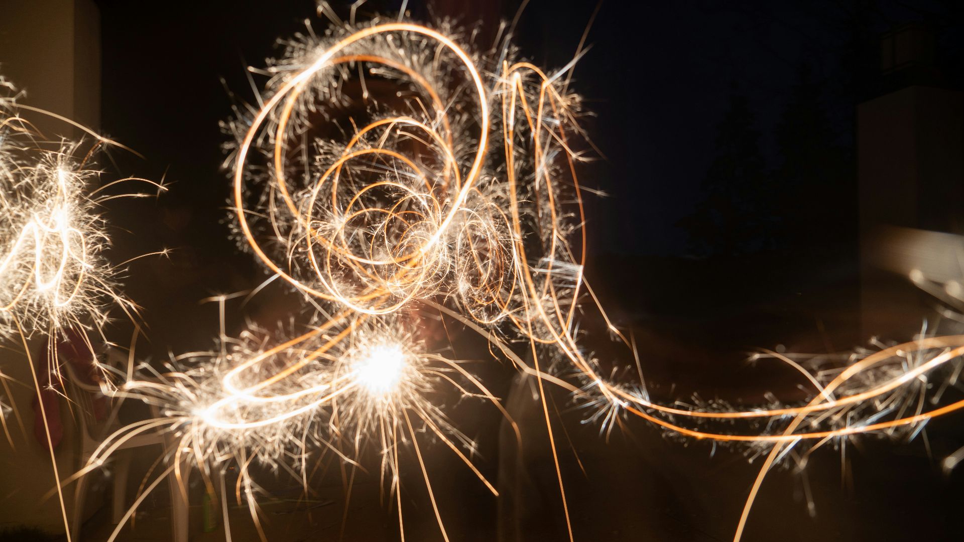 a person holding a sparkler in their hand