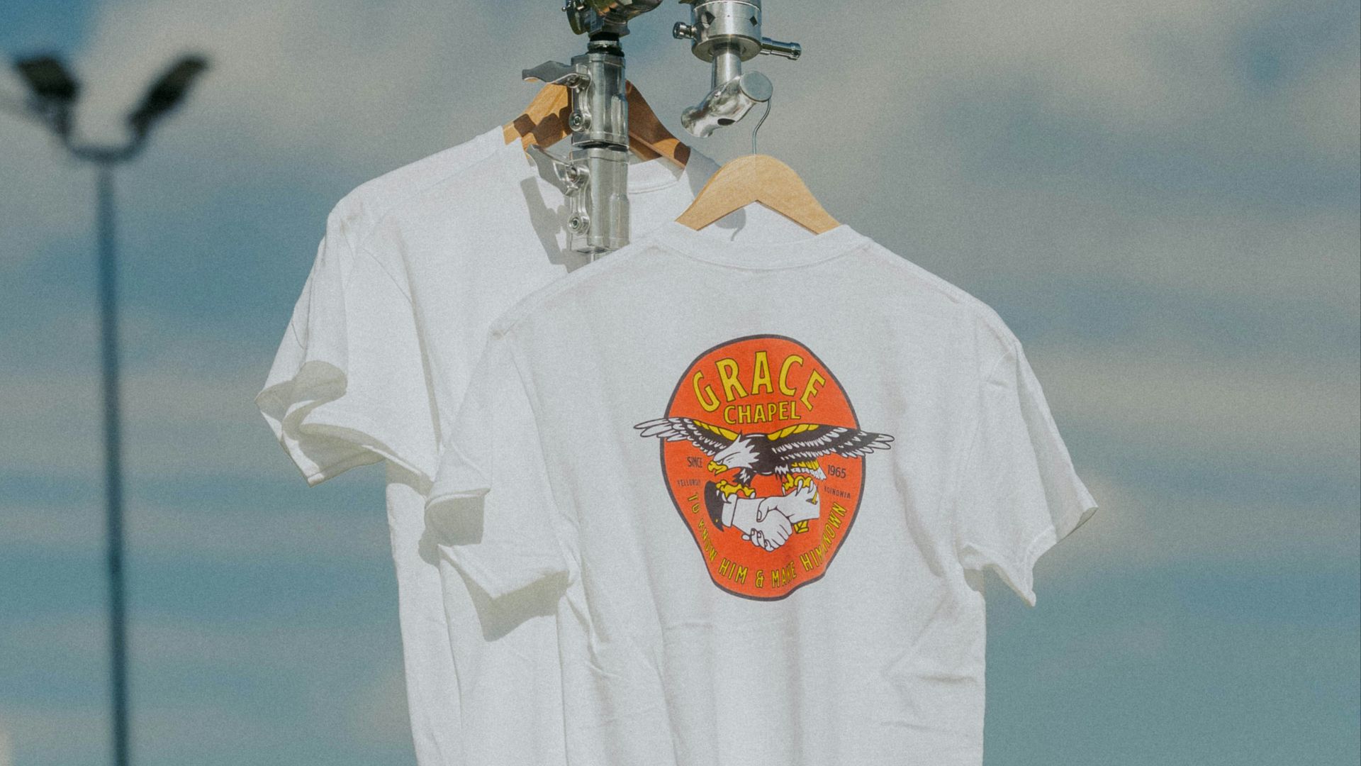 a white shirt hanging on a clothes line