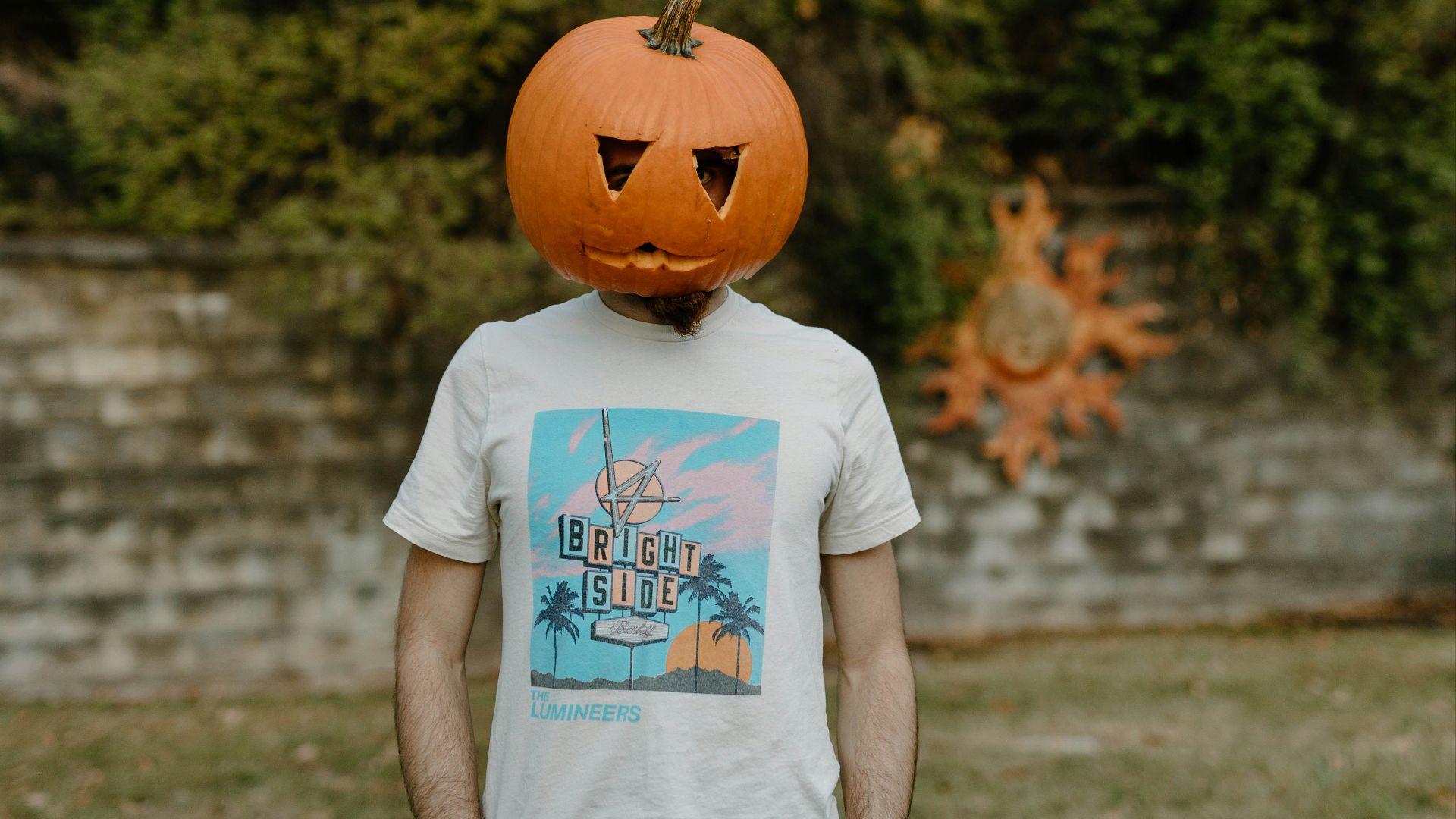 a person wearing a pumpkin hat