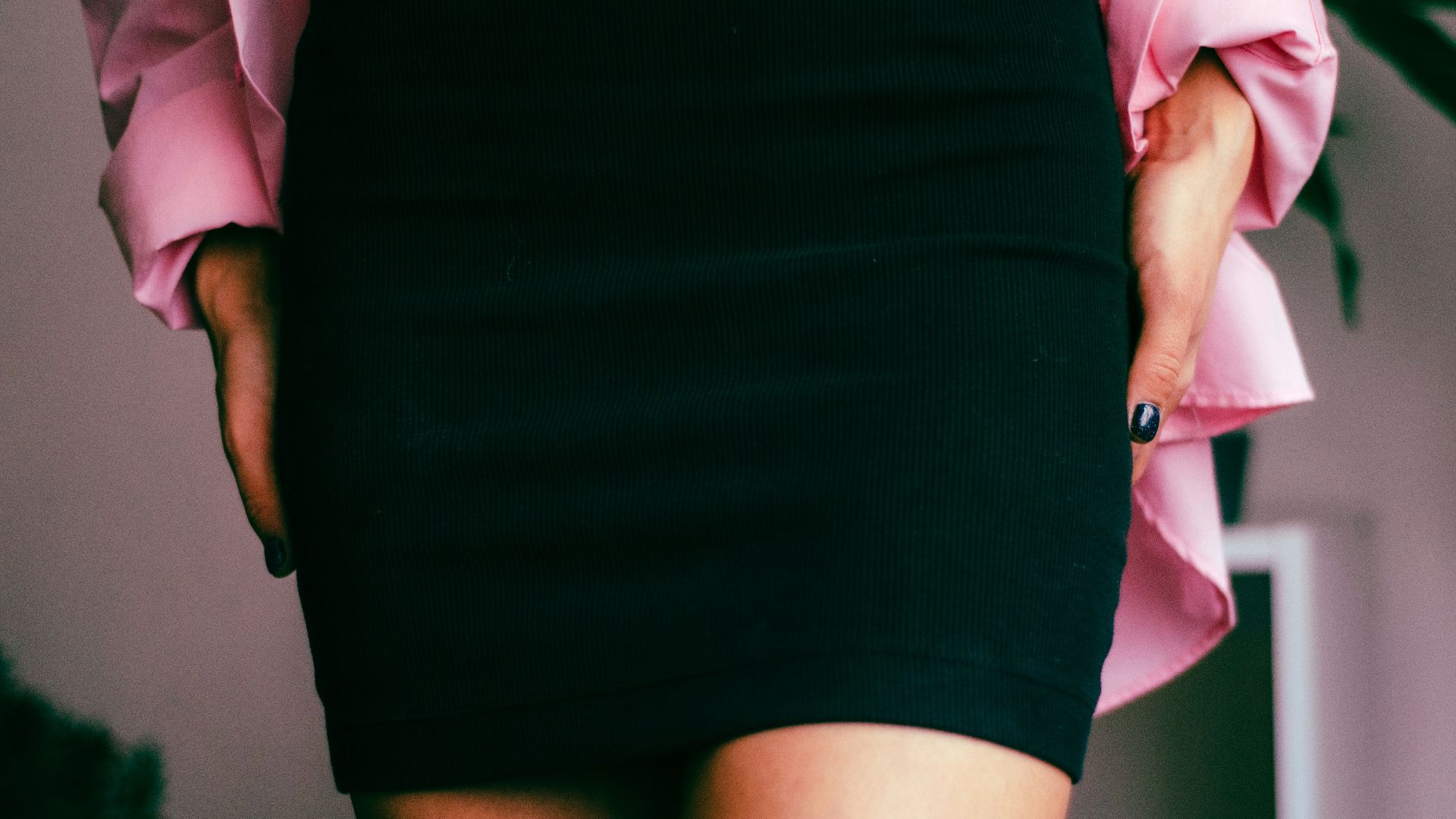 a close up of a person wearing a skirt