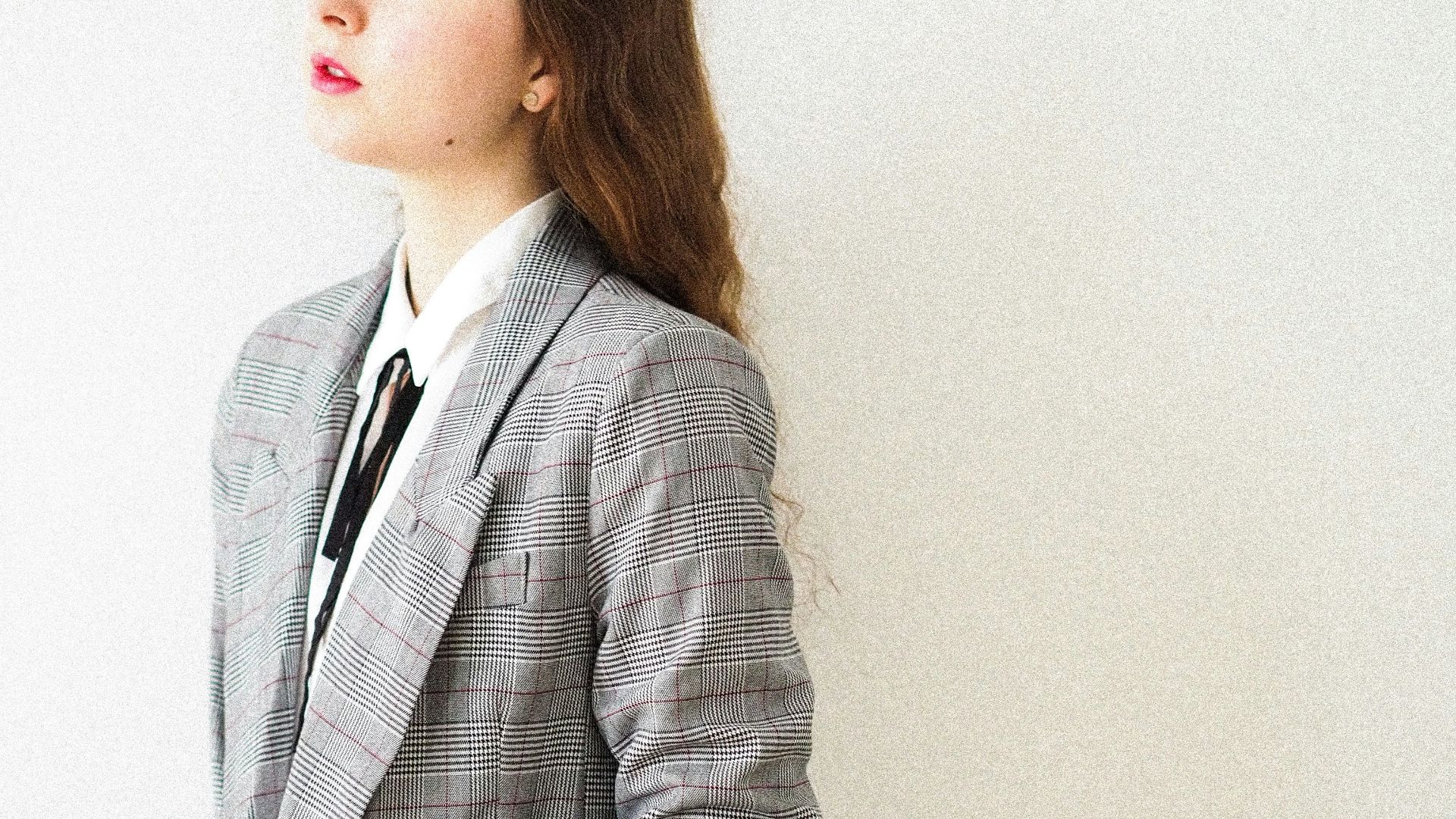 woman in gray coat standing