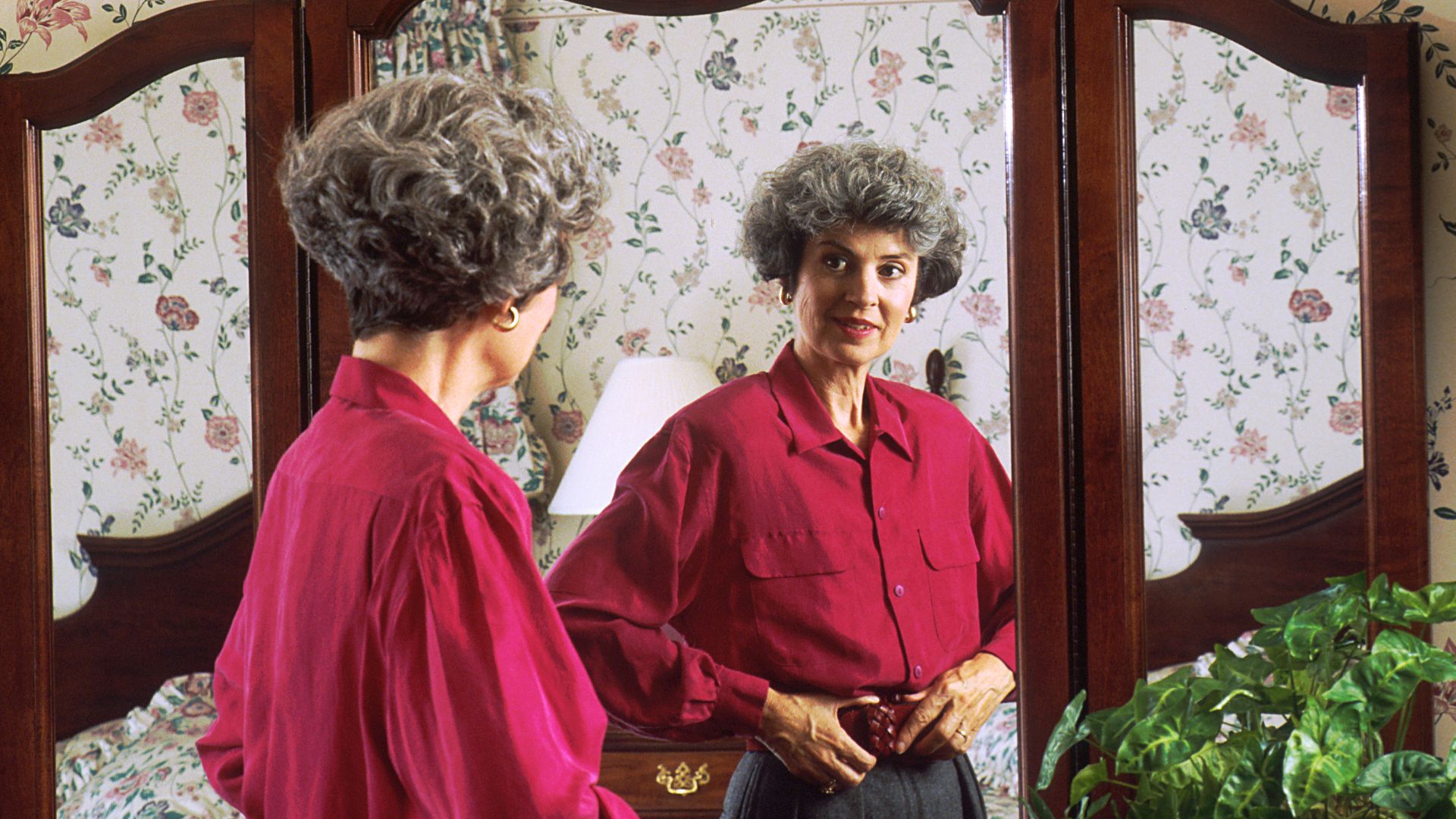 File:Woman looking in a mirror.jpg