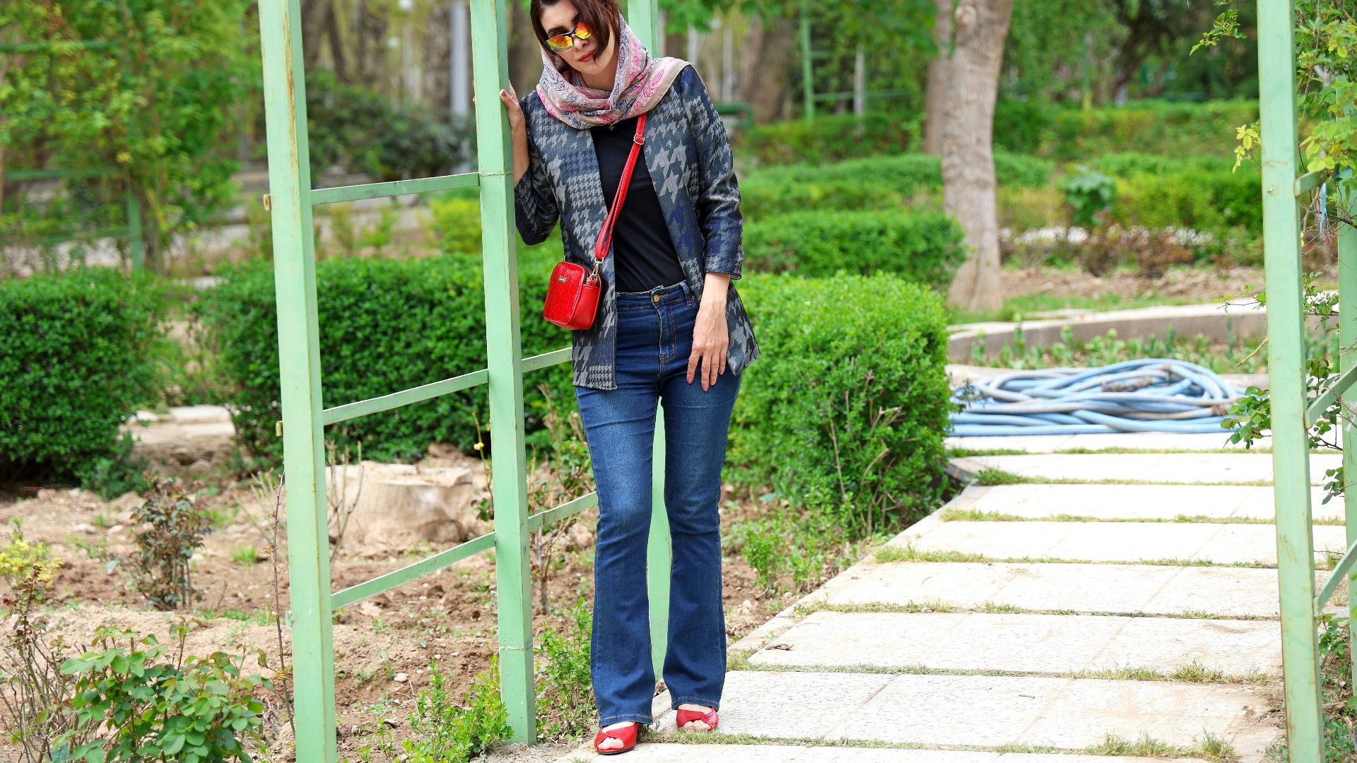 Woman standing on a path in a park