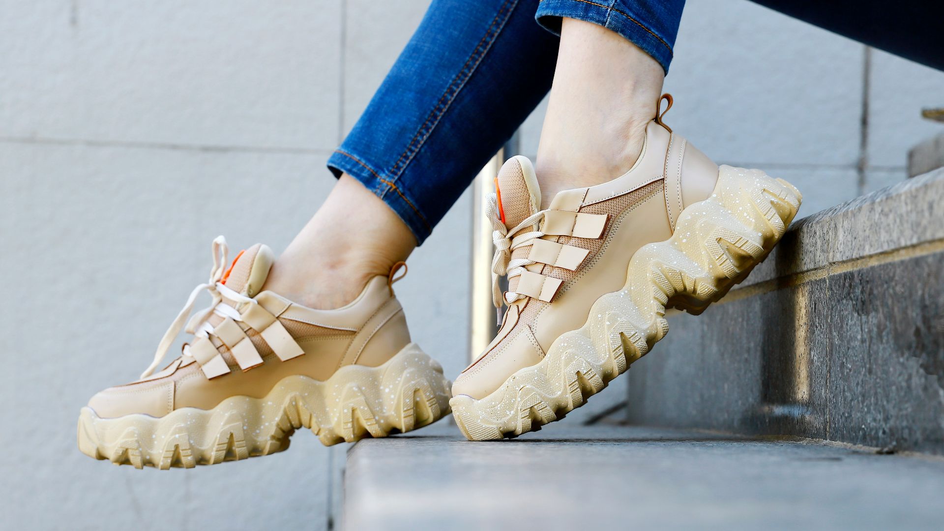 a person's feet wearing brown shoes