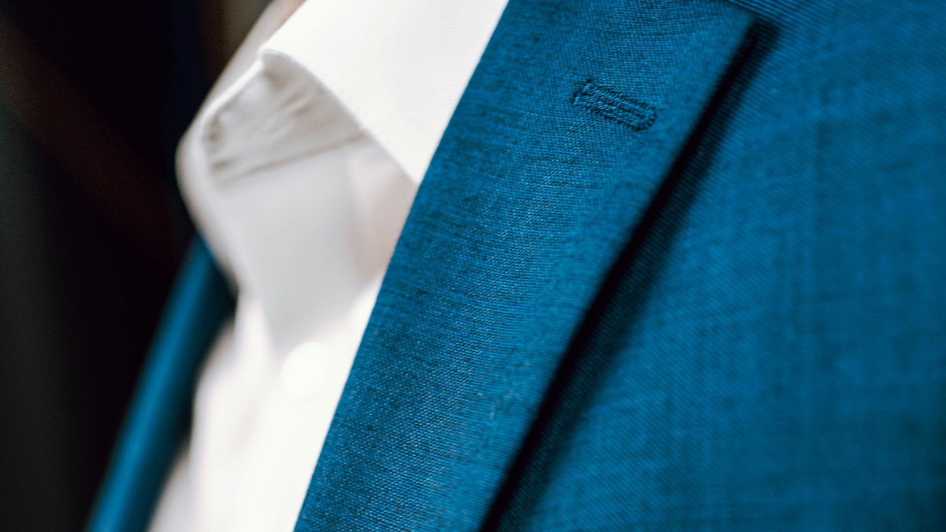 person in green suit jacket