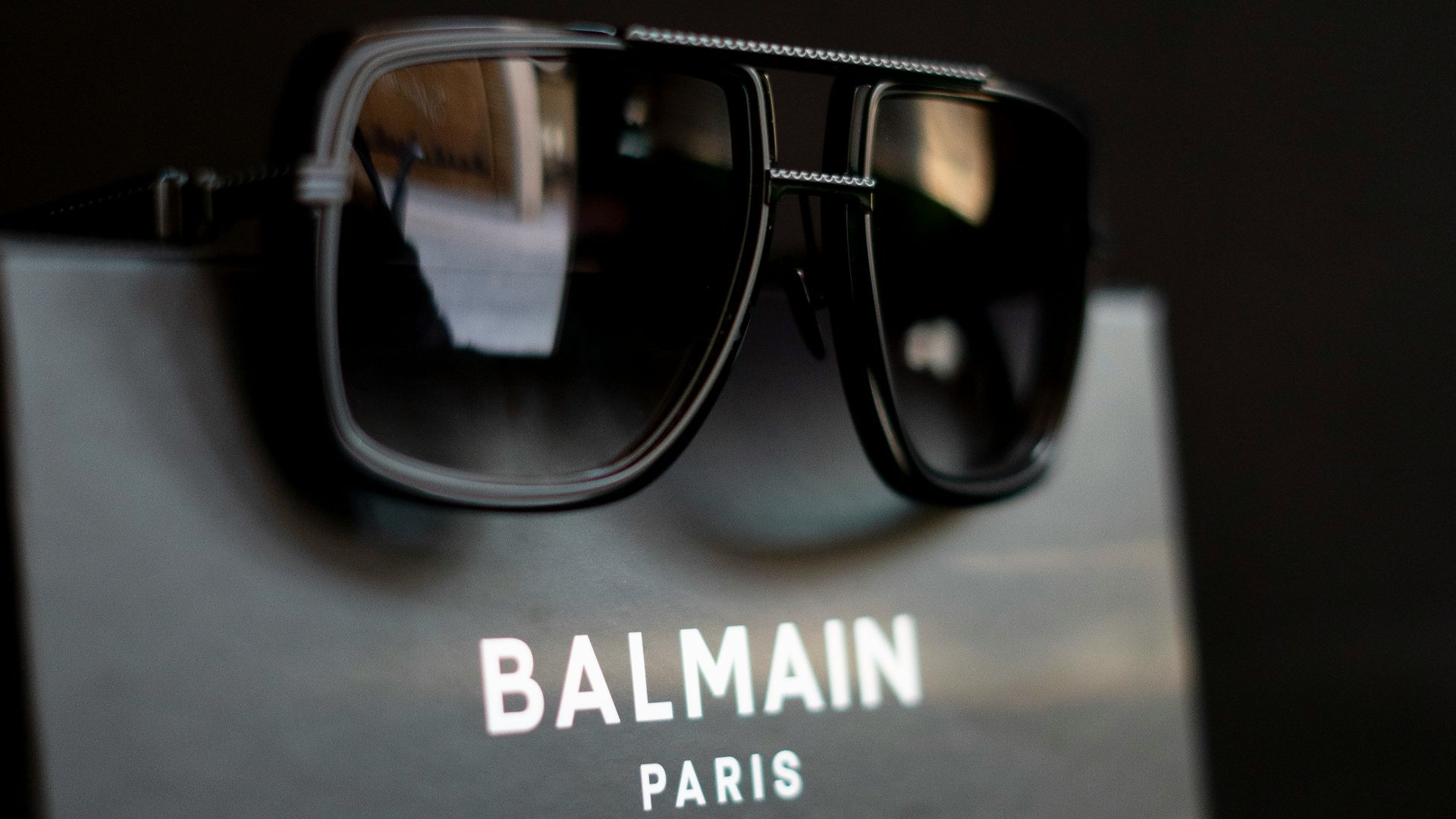 A pair of sunglasses sitting on top of a box