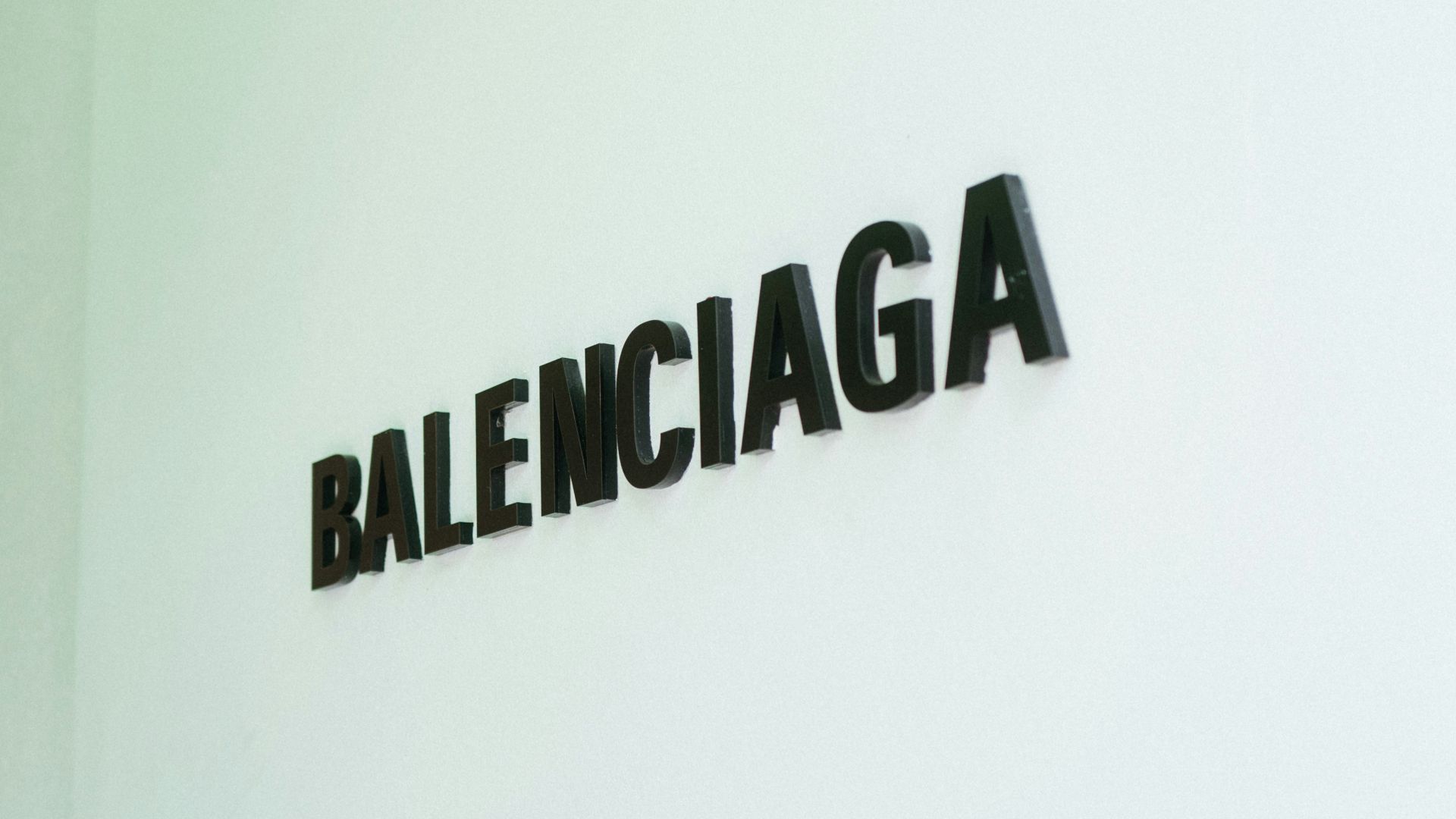 a white wall with a sign that says balenocaga on it