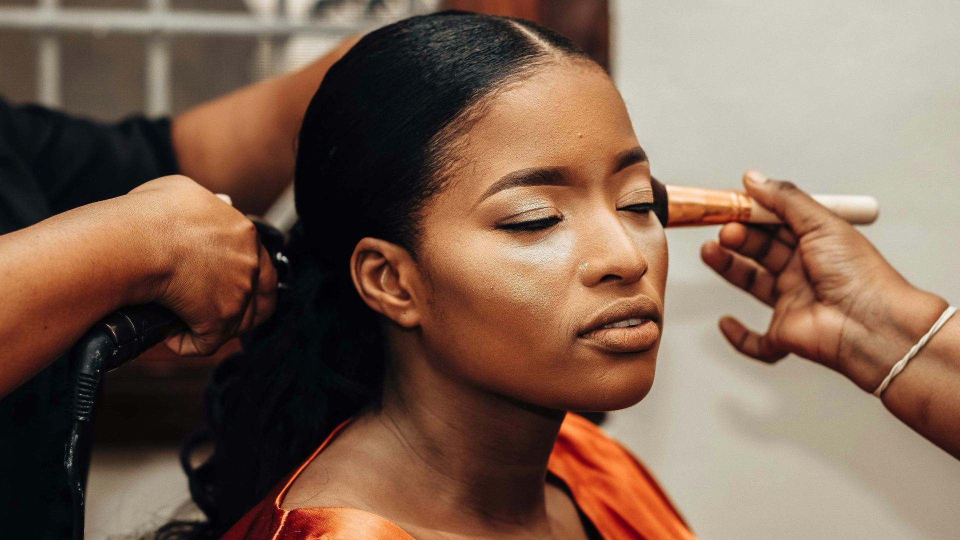 a woman getting her hair done