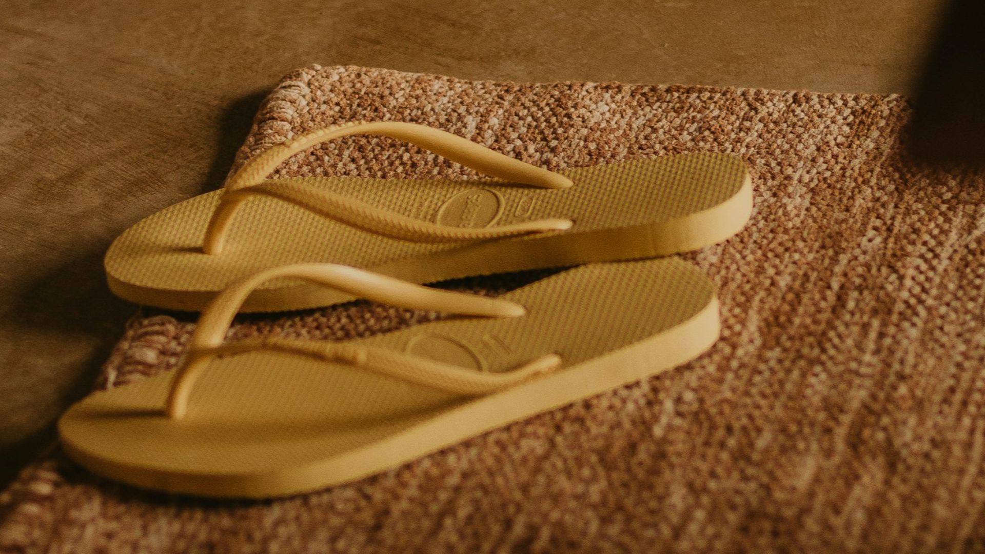 a pair of yellow scissors laying on the floor