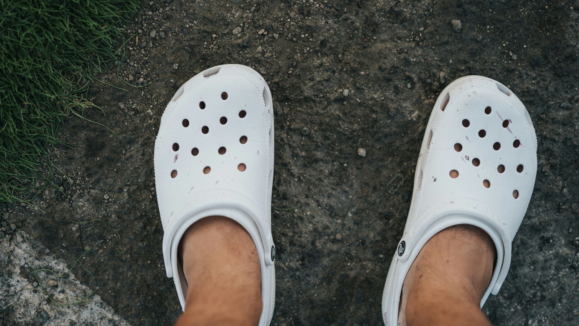 person wearing white rubber clog