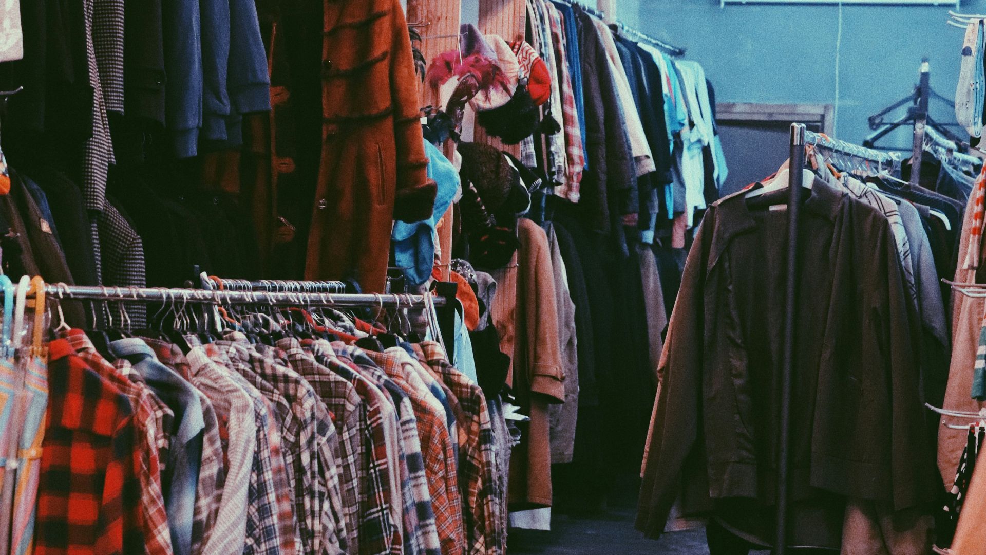 assorted clothes on clothes stand