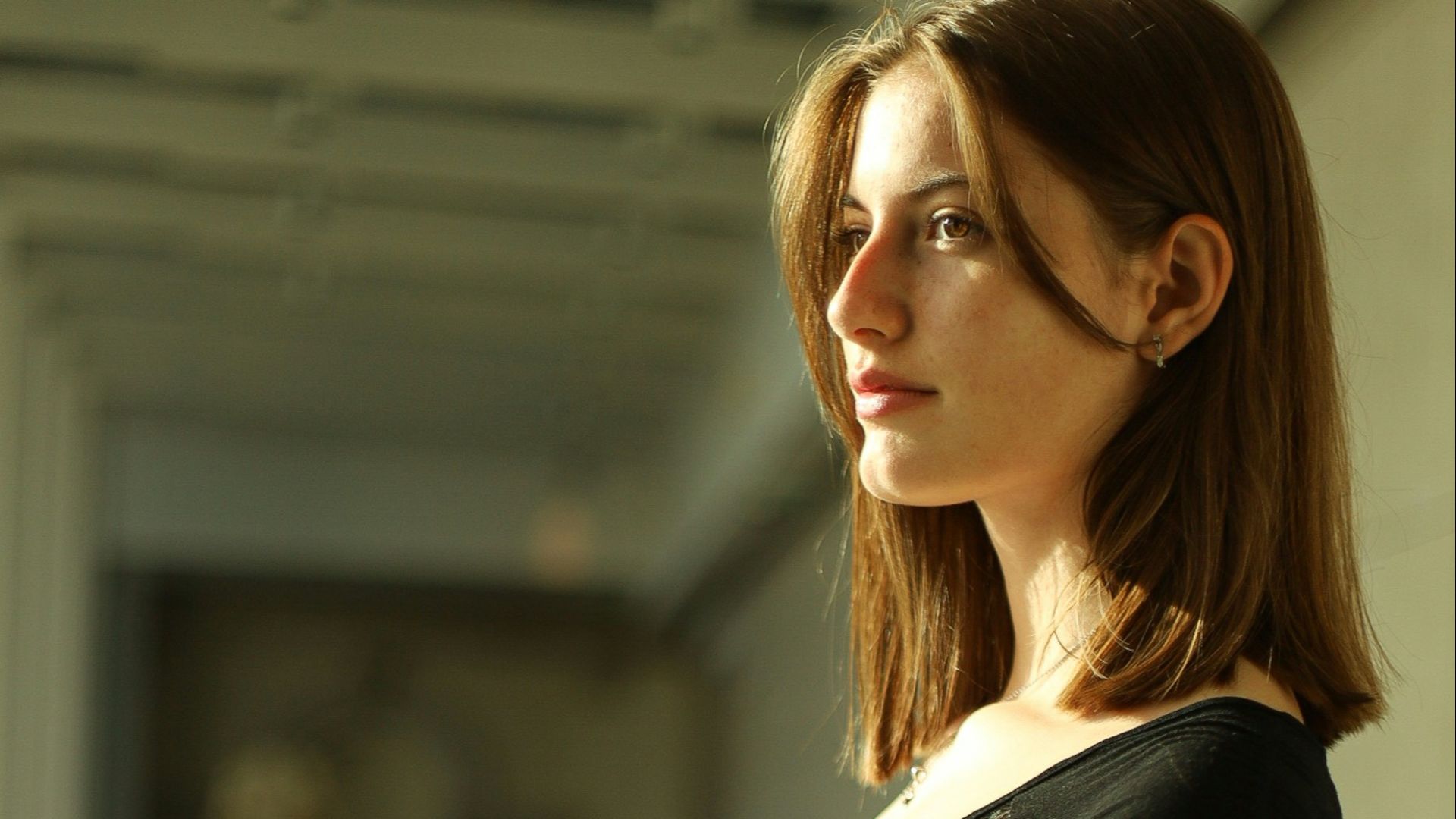 a woman leaning on a railing