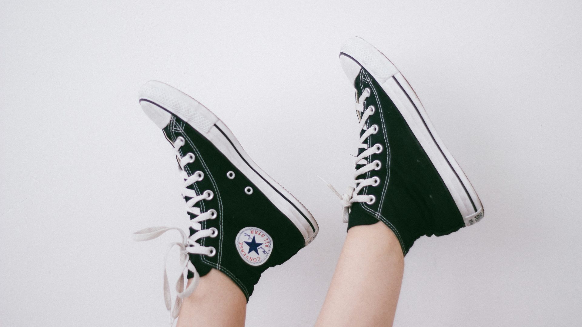 black and black and white Converse All Star high-top sneakers