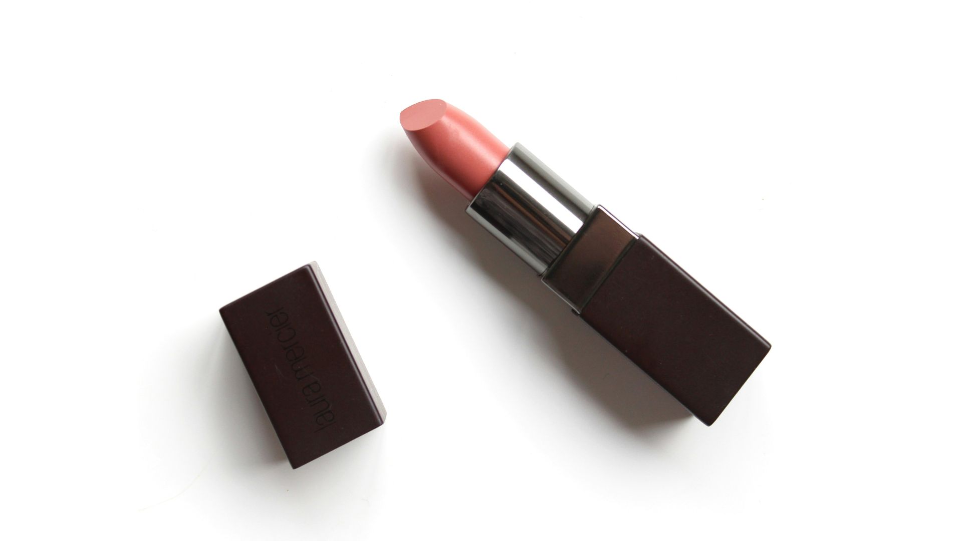 red lipstick on white surface