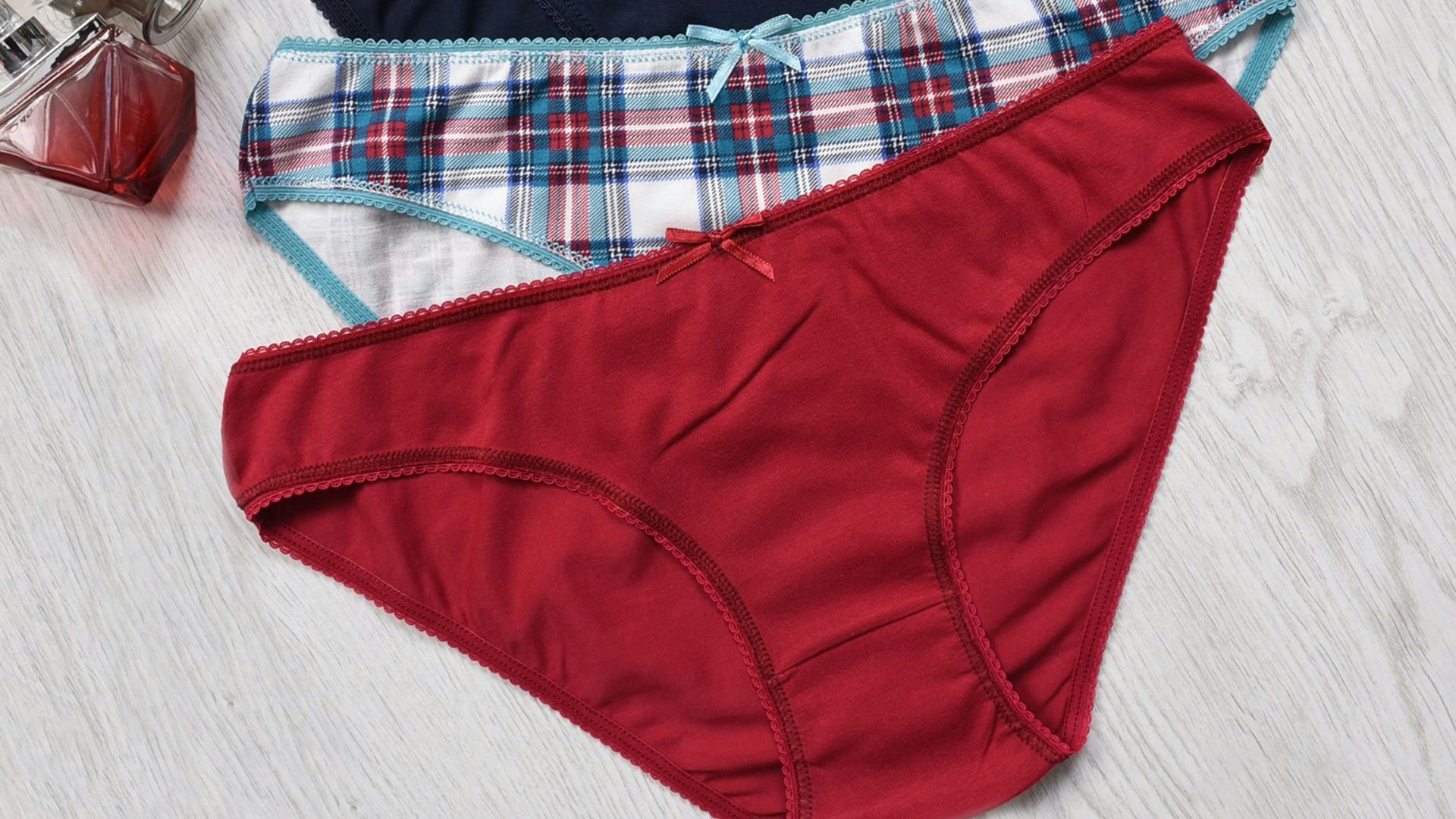 a pair of underwear sitting on top of a wooden floor