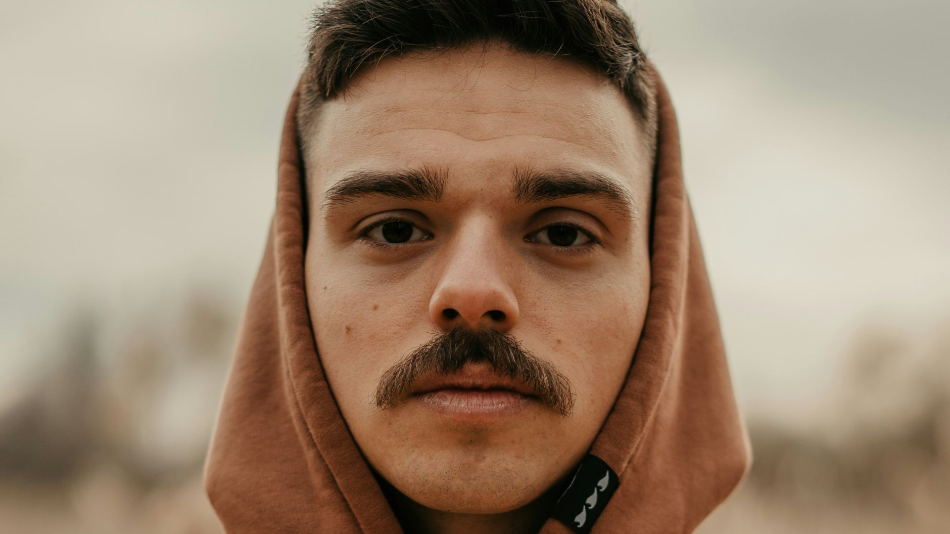 man in pink pullover hoodie