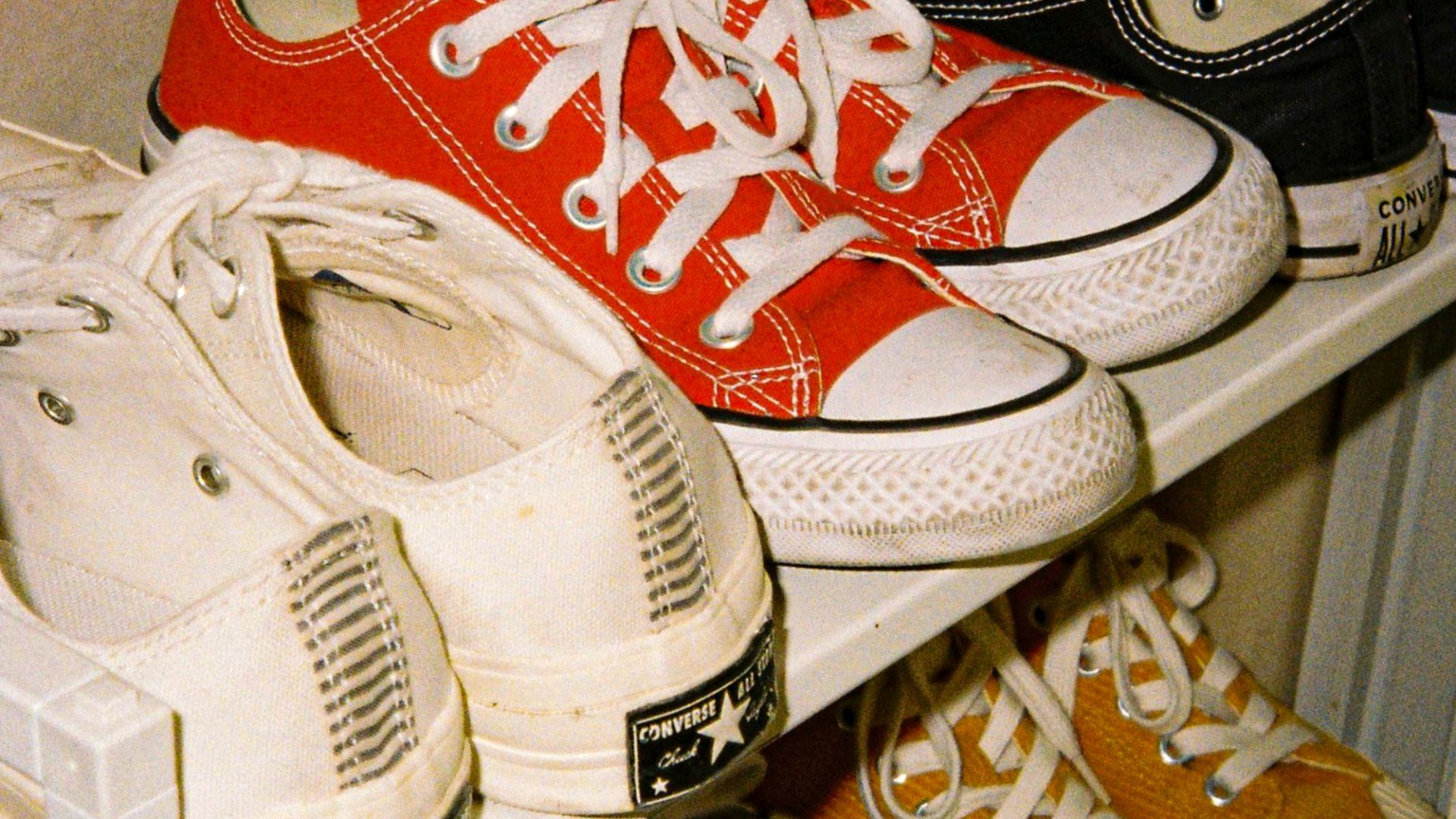 white and red nike athletic shoes