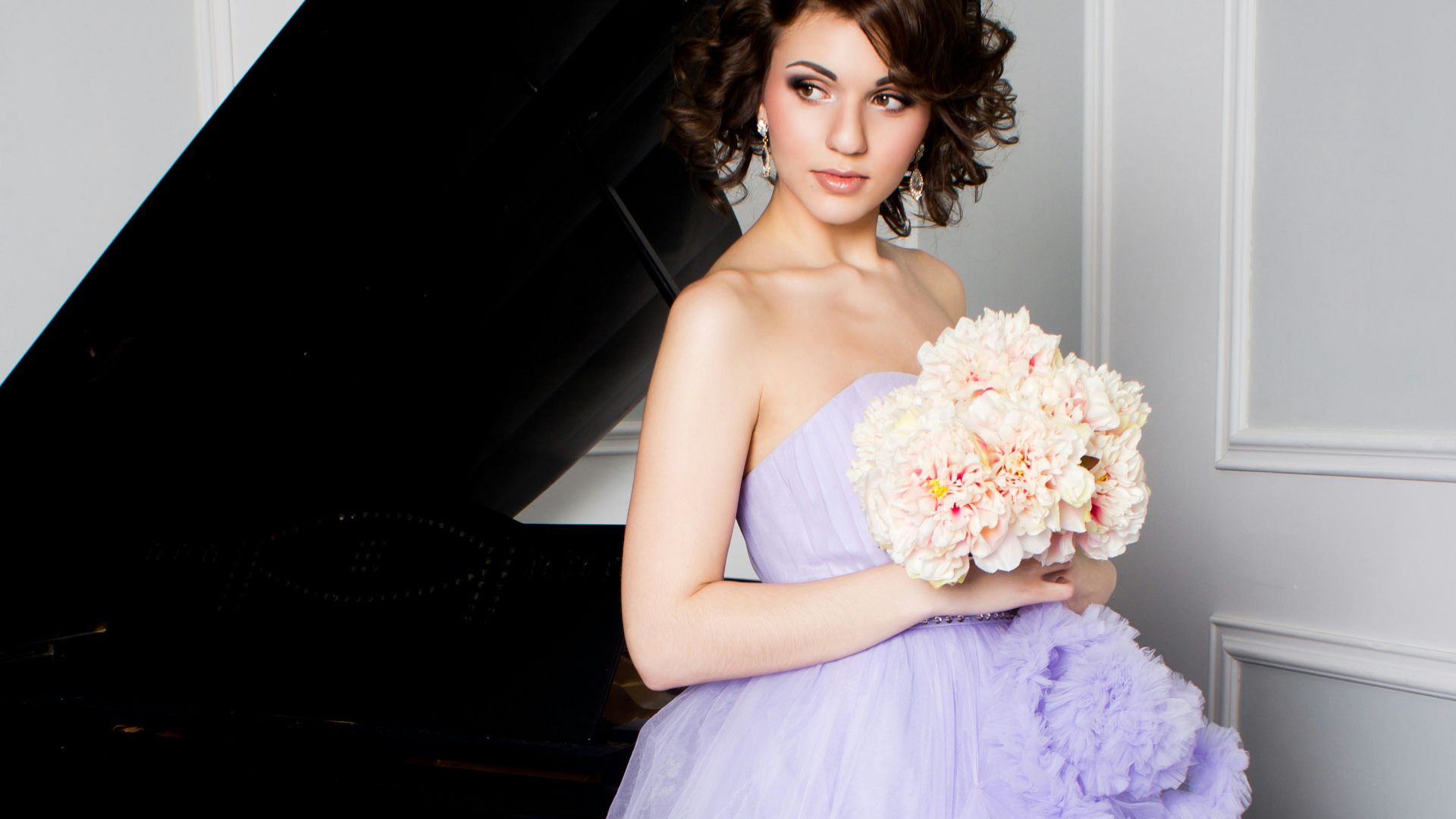 woman in purple off-shoulder dress holding bouquet of flowers
