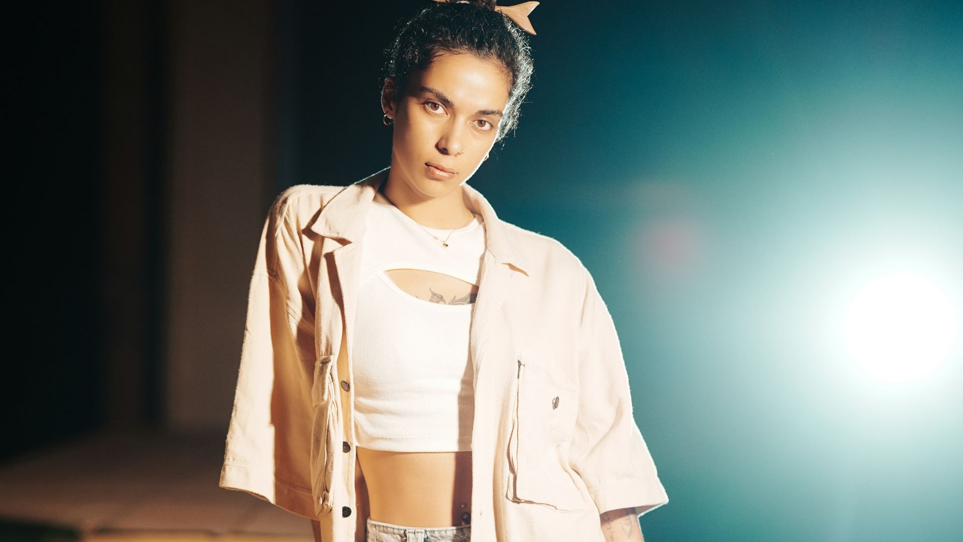 Young woman in casual clothes leaning on table