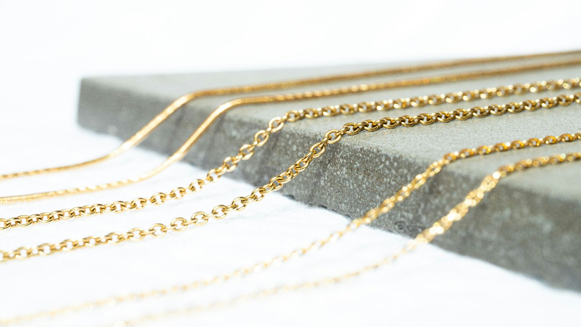 a gold chain with a black band